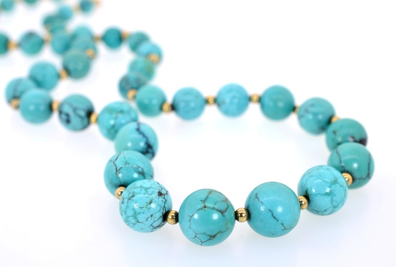 An organic strand of thirty-nine Turquoise beads interspersed with thirty-nine 14KT yellow gold beads.  The beads measure between 7.25 to 14.00 millimeters and each showcases its natural veins which add to the beauty of this piece.  The strand is