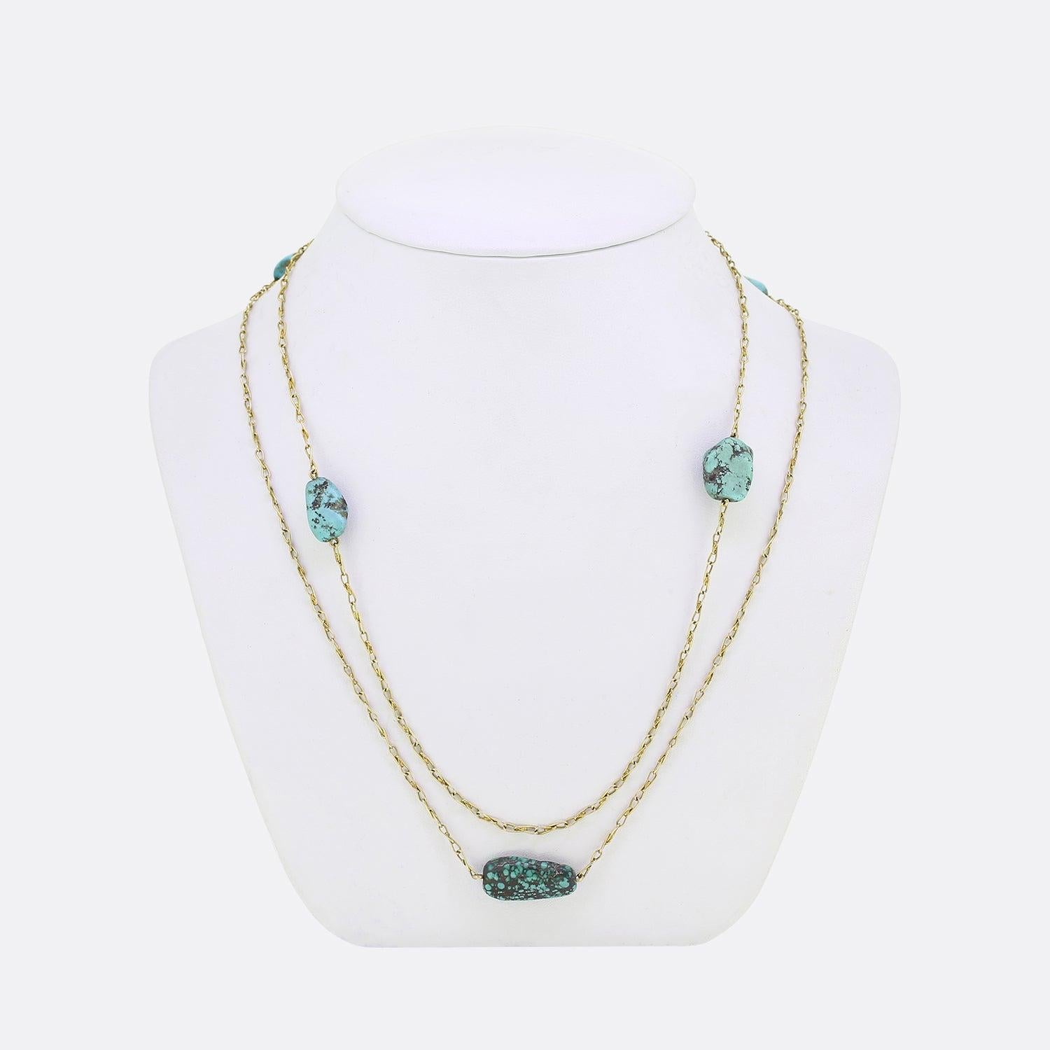 Here we have a unique vintage long chain necklace. The chain is of a curved loop belcher style and features an ensemble of significant turquoise nuggets of differing sizes; each of which has been pierced at the centre and set harmoniously in a