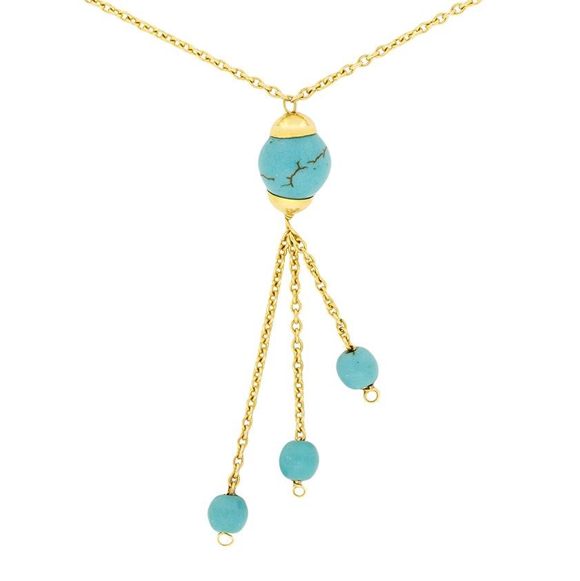 This wonderfully unique necklace features a total of ten turquoise. Seven of the turquoise are evenly spread along the 17″ long 18 carat yellow gold necklace. They all measure 8mm in diameter. The other three turquoise are smaller, at 4.5mm and