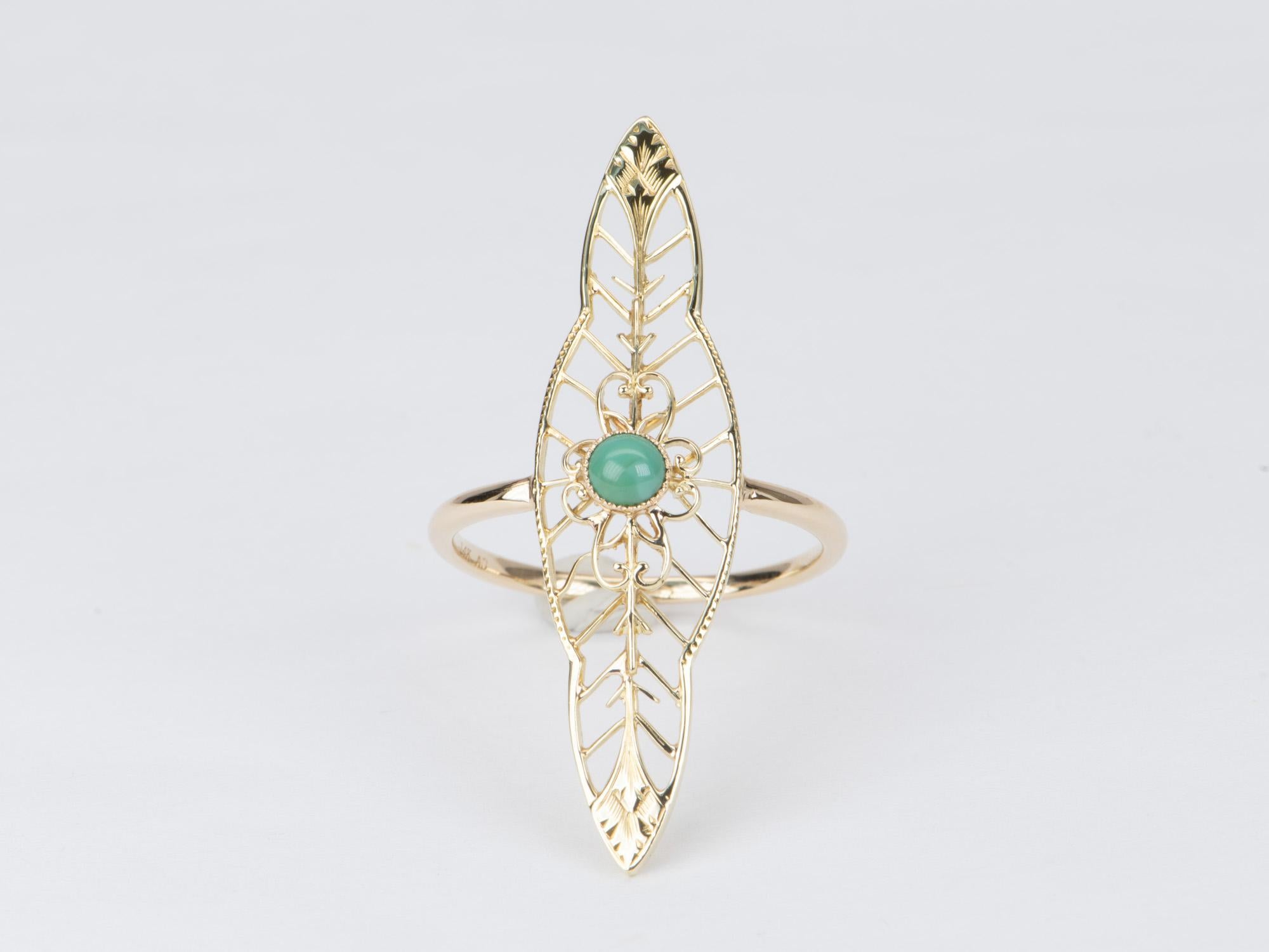 This exquisite Vintage Turquoise Pin Converted to a Navette Ring is one-of-a-kind and crafted in solid 14K gold. Its intricate filigree design and long marquise shape will flatter anyone hand. A perfect addition to any discerning jewelry