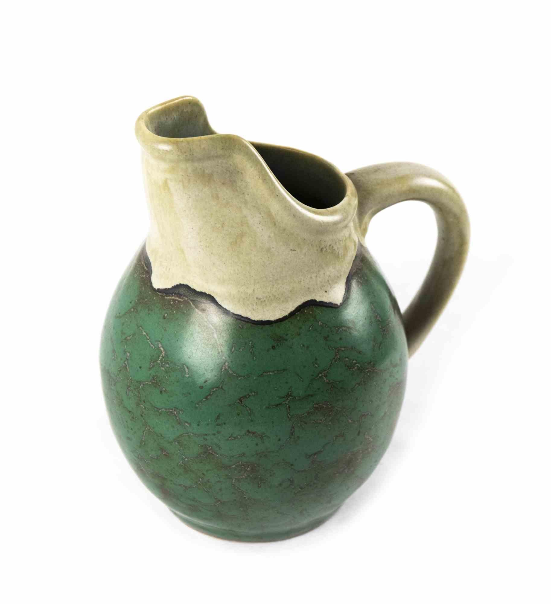 Vintage Turquoise pitcher is a decorative object realized in the second half of 20th century.

Made in Italy. 

The object is realized in metal with a double decoration. A grey band on the upper side and a turquoise colored body. Between the two