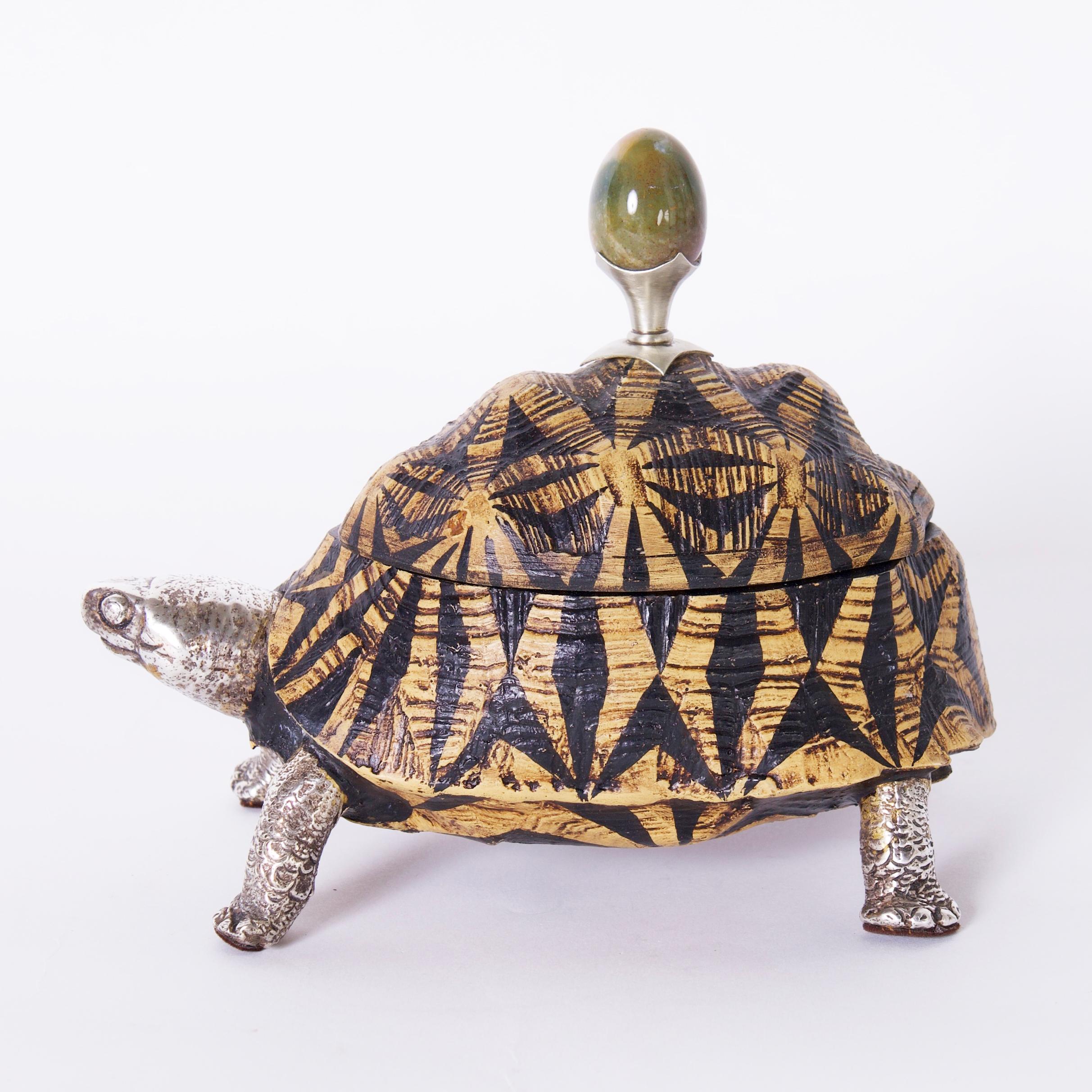 Whimsical mid century trinket box crafted in composition in a turtle form having a polished stone lid handle and silver plate on brass head and legs. Signed Antony Redmile inside the box. 
