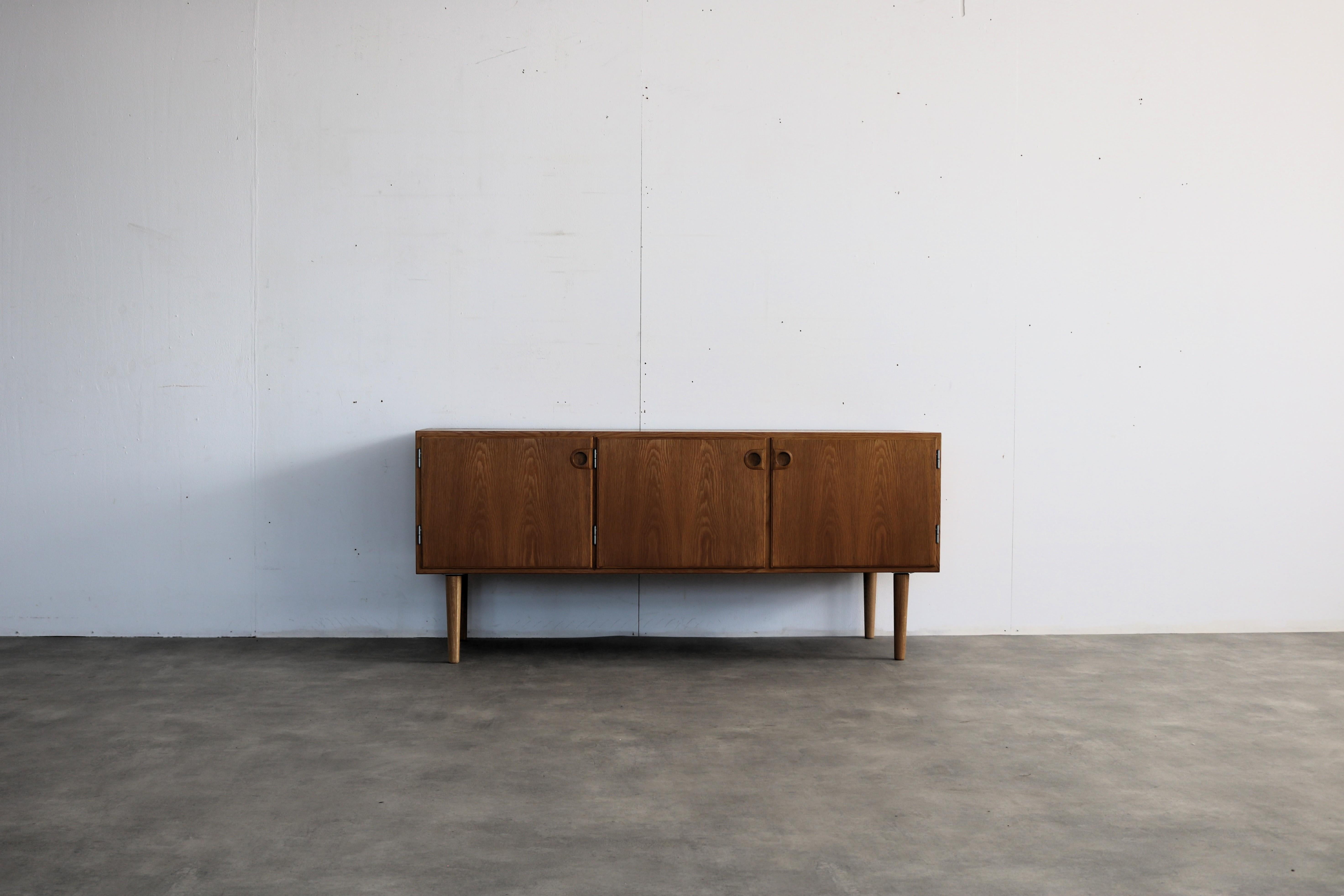 vintage TV cabinet  dresser  sideboard  Danish

period  60's
design  unknown  Denmark
condition  good  signs of use  originally there was an upper cupboard on it; 
size  65.5x149x51 

details  oak; 

article number  2701