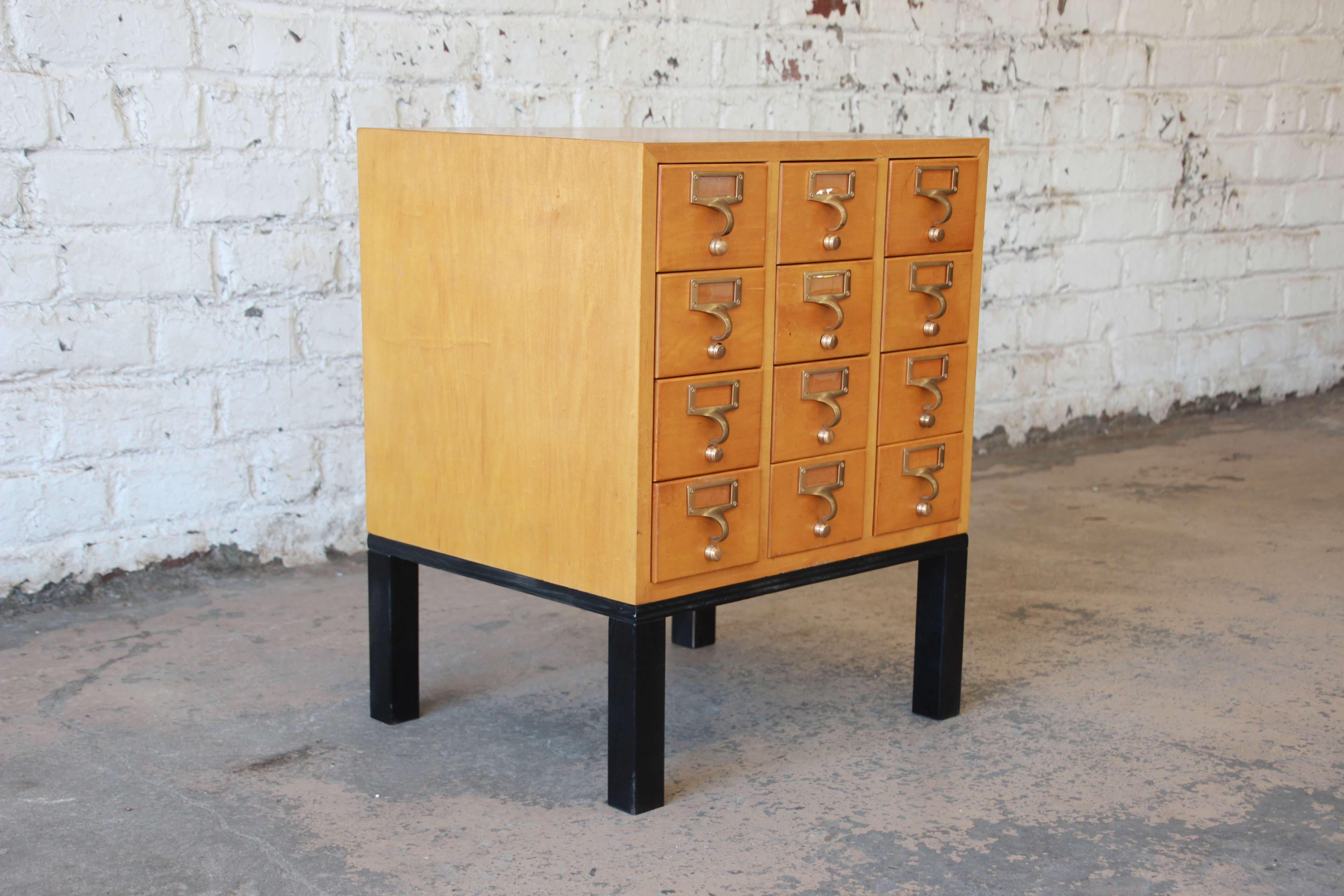 Offering a very nice and rare twelve -drawer card catalog by Gaylord Bros, Inc. This unique piece can easily function as a end/side table or nightstand. It sits on a custom black base and is made from solid birch. All drawer function and open and