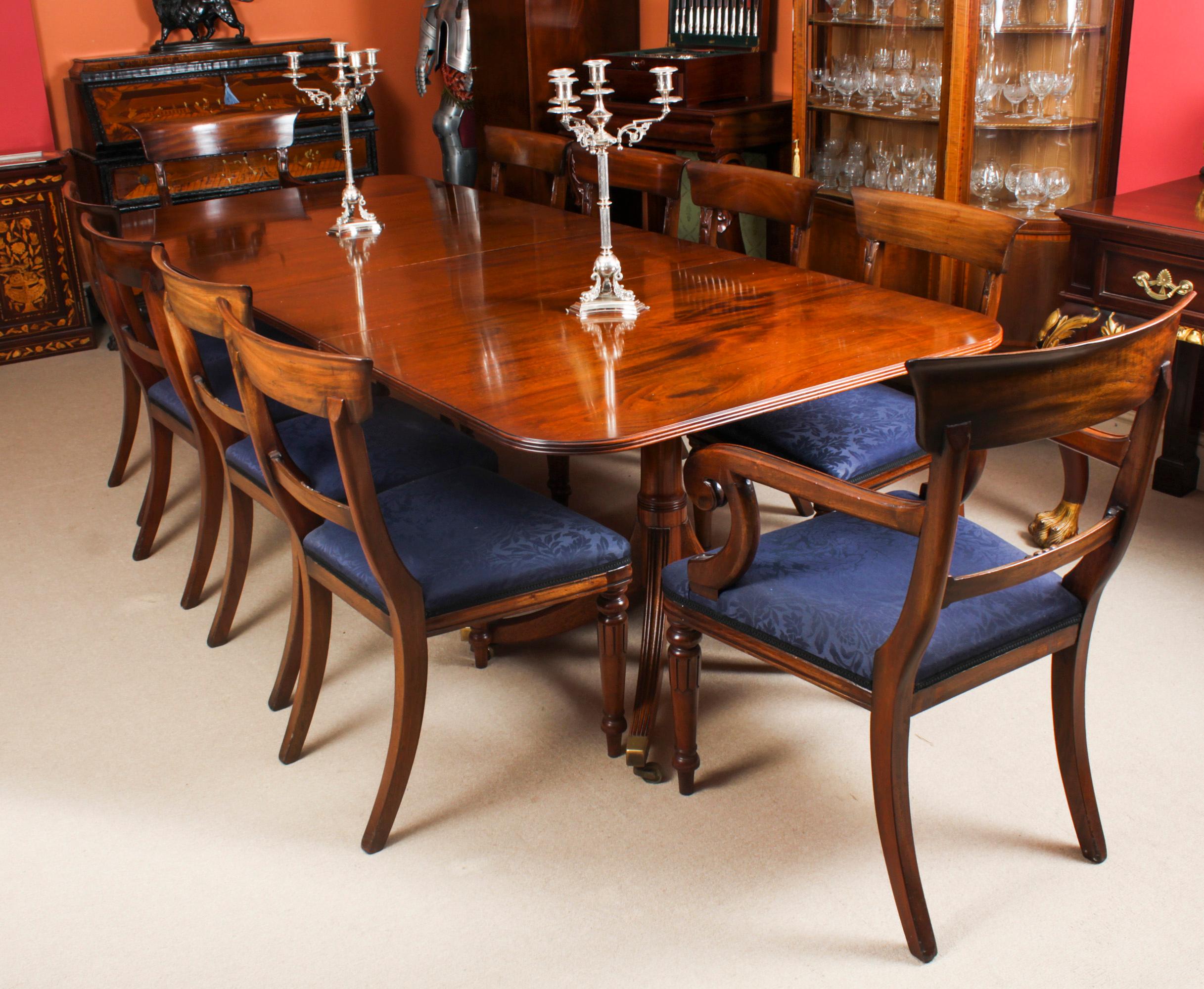 This is a fabulous Vintage Regency Revival dining set comprising a dining table and a set of ten bar back dining chairs, by William Tillman, Circa 1975 in date.

The table is made of stunning solid flame mahogany and is raised on twin 