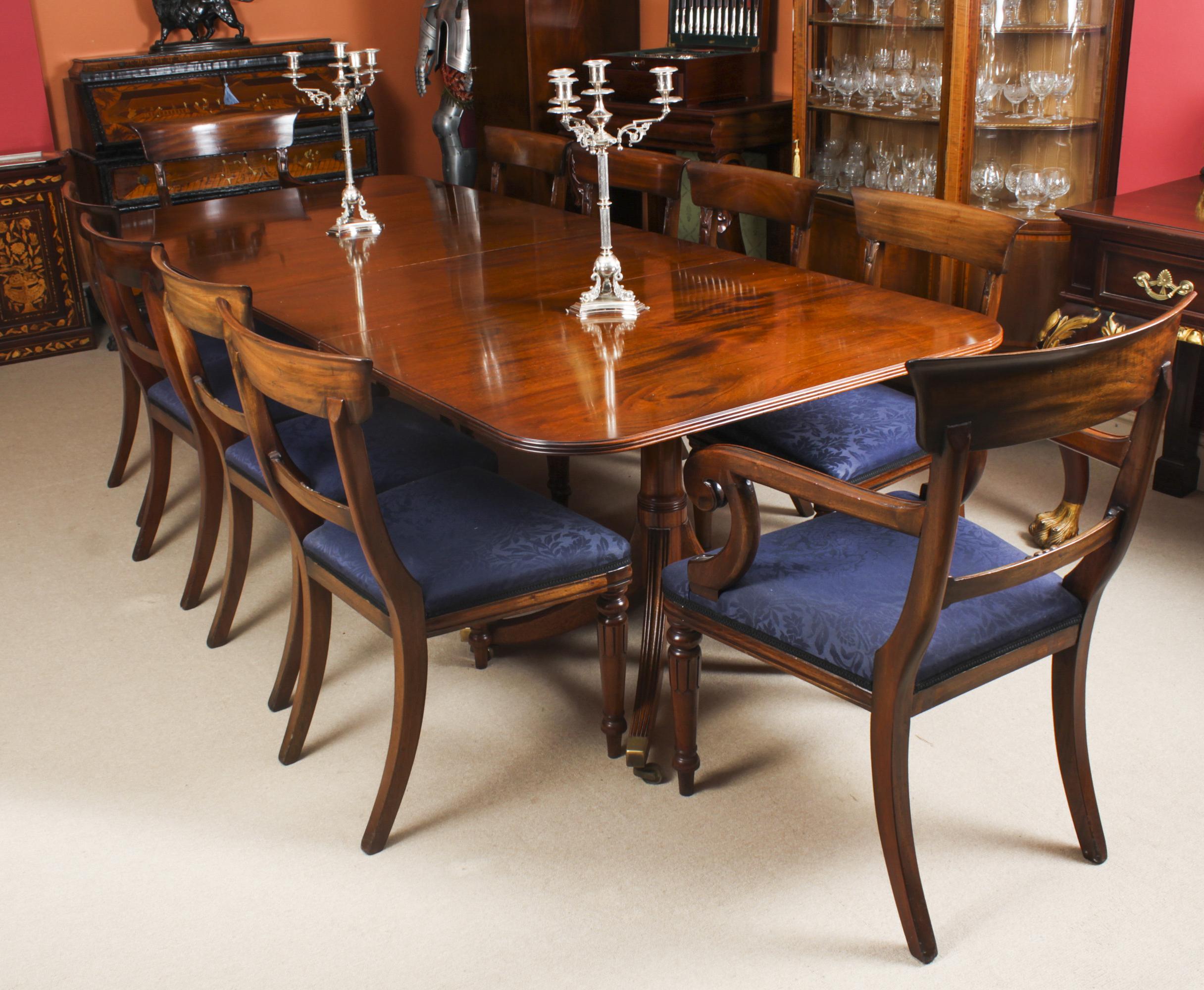 This is  a fabulous Vintage Regency Revival dining set comprising a  dining table and a set of ten bar back dining chairs, by William Tillman, Circa 1975 in date.

The table is made of stunning solid flame mahogany and is raised on twin 