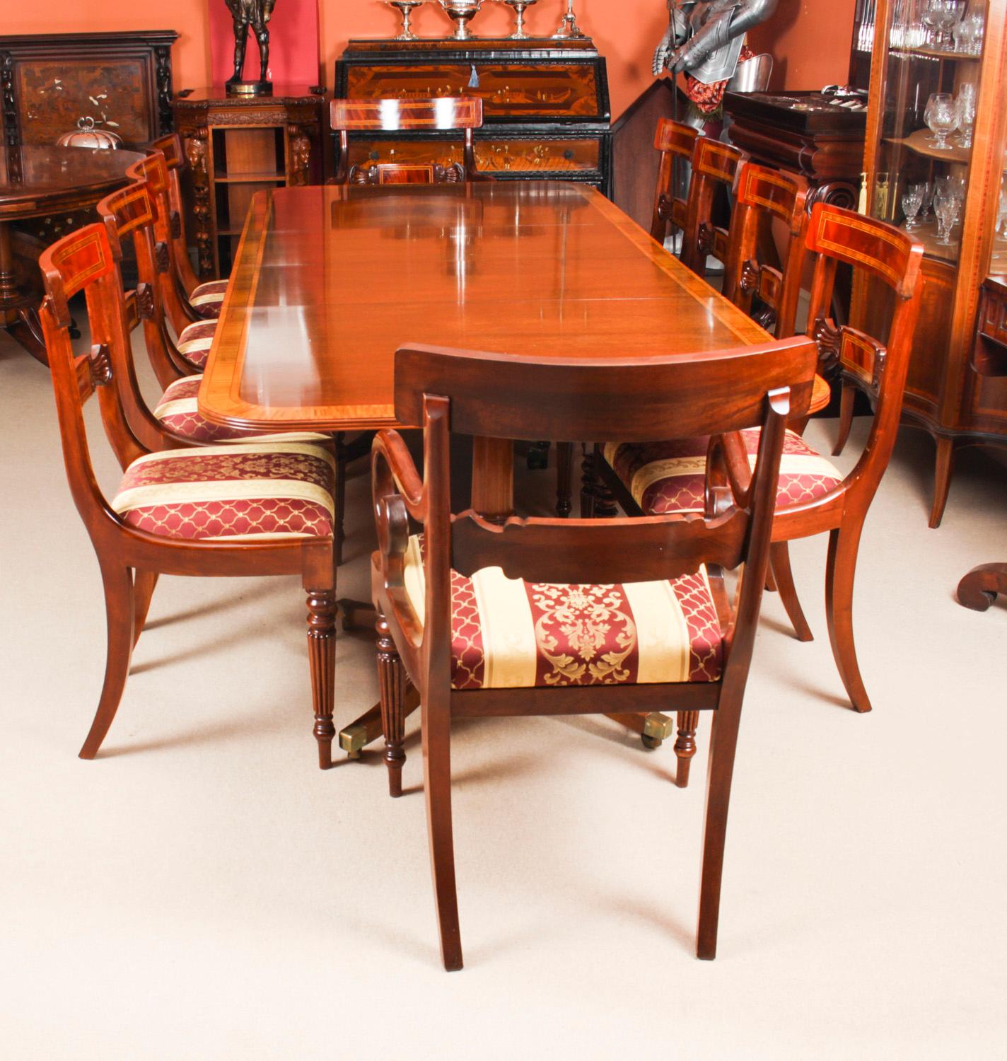 This is fabulous Vintage Regency Revival dining table by the master cabinet maker William Tillman Circa 1980 in date with a set of ten Regency Revival dining chairs.

The table is made of stunning solid flame mahogany with satinwood crossbanding and