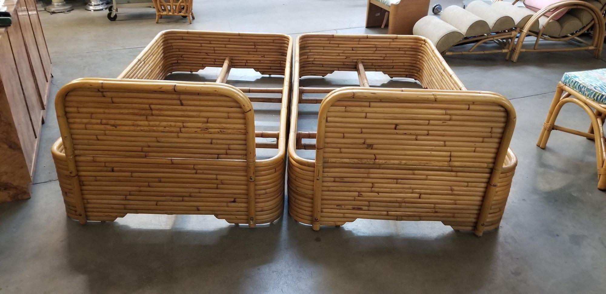 This twin-size bed frame pair was built by Seven Seas Rattan Company (1938 to 2011) in the 1950s. Each bedframe features a stacked rattan base with a stacked rattan headboard. and takes a single-size US mattress. 
 
It is modeled after the smaller