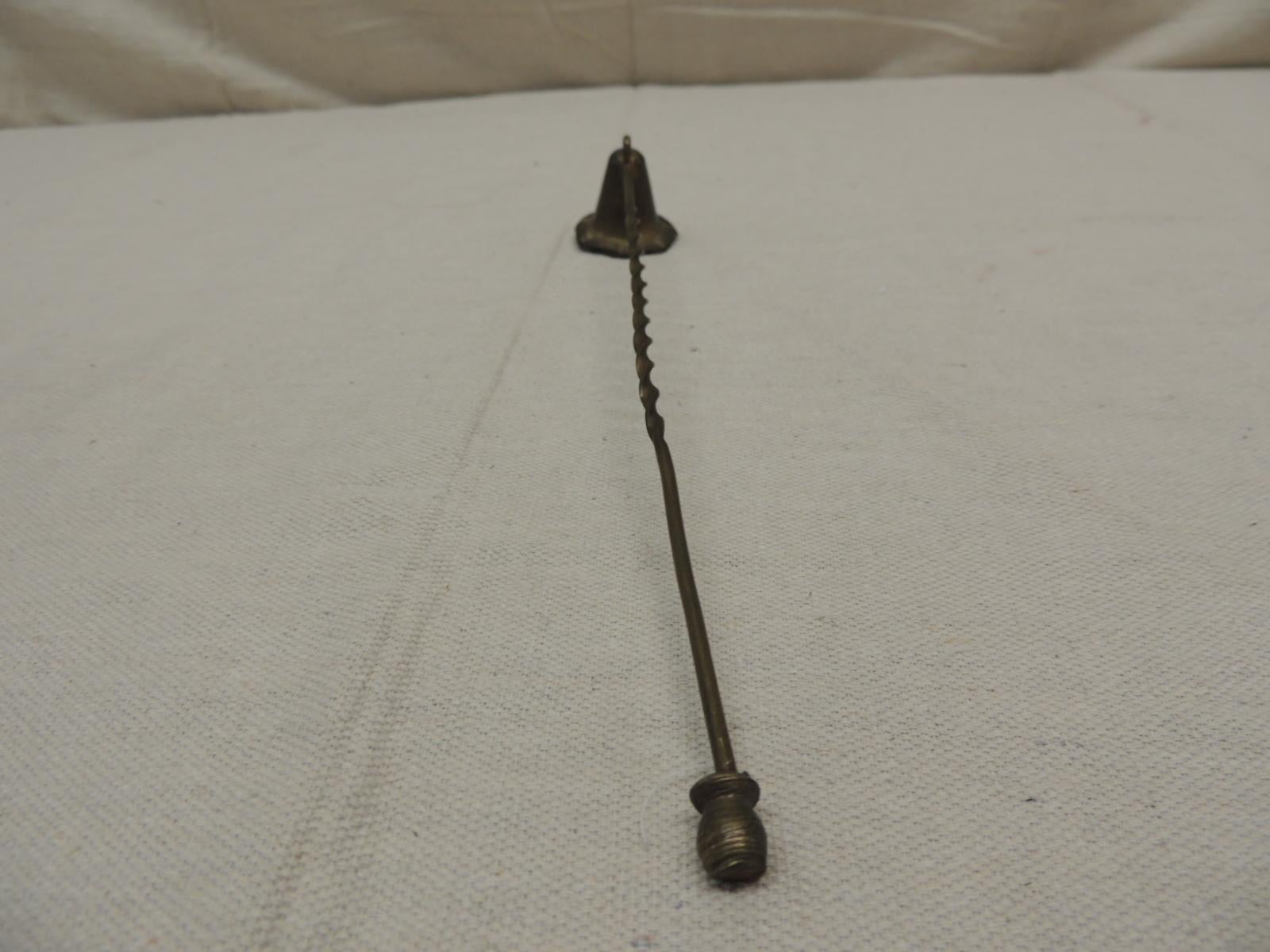 Vintage twisted handle brass snuffer
with trumpet shape.
Size: 11