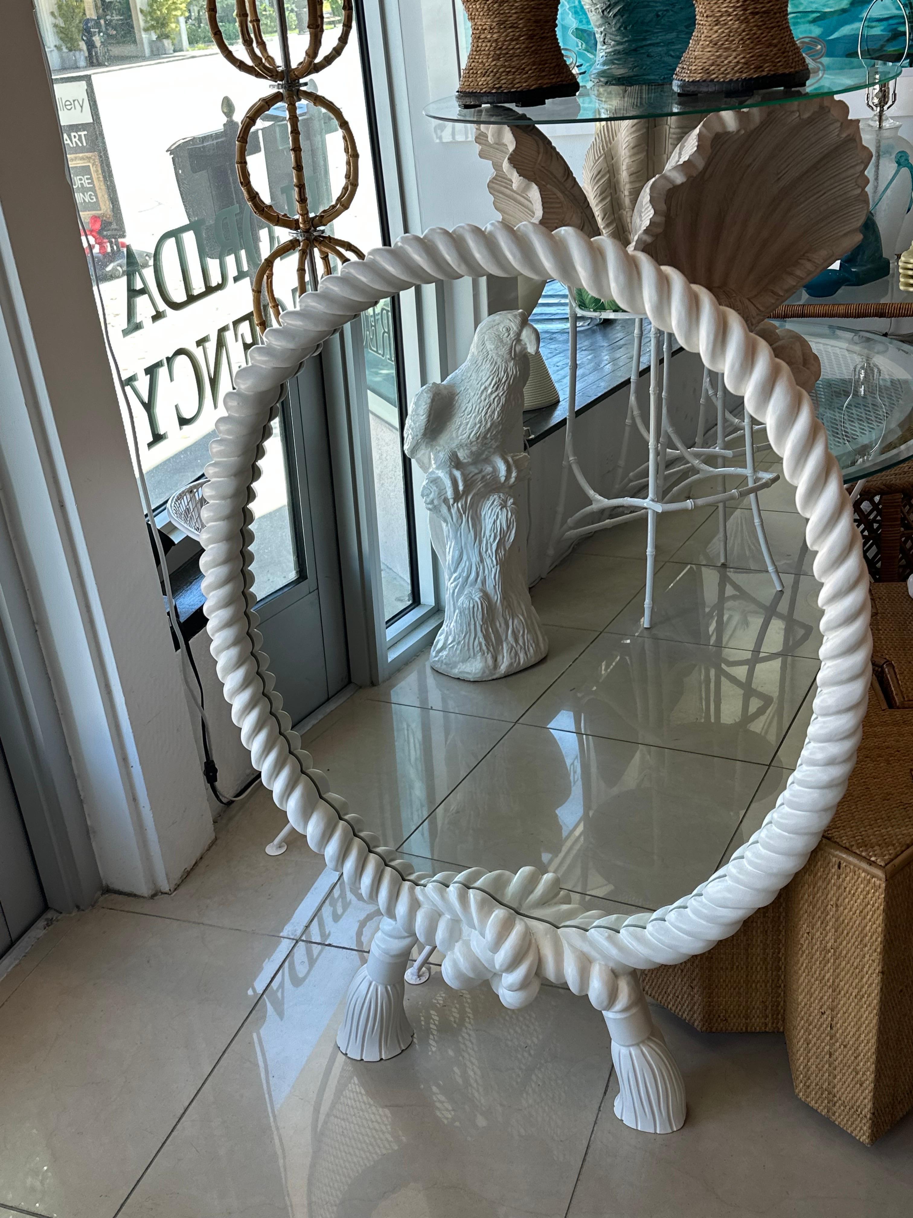 Beautiful vintage twisted faux rope and tassels wall mirror. Lacquered in a soft white satin. Matching mate listed separate if a pair is needed. Dimensions: 3 D x 30 W x 42 H. 