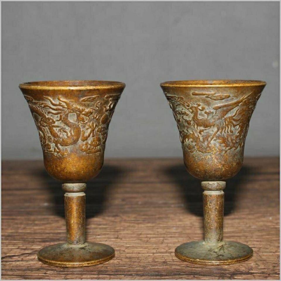 The Vintage Two Bronze Dragon Phoenix High Heeled Cups are truly unique and special collectible pieces. 

Cup Details:
Material: bronze
6.5 cm high
4 cm diameter
Originating from China
19th century.
