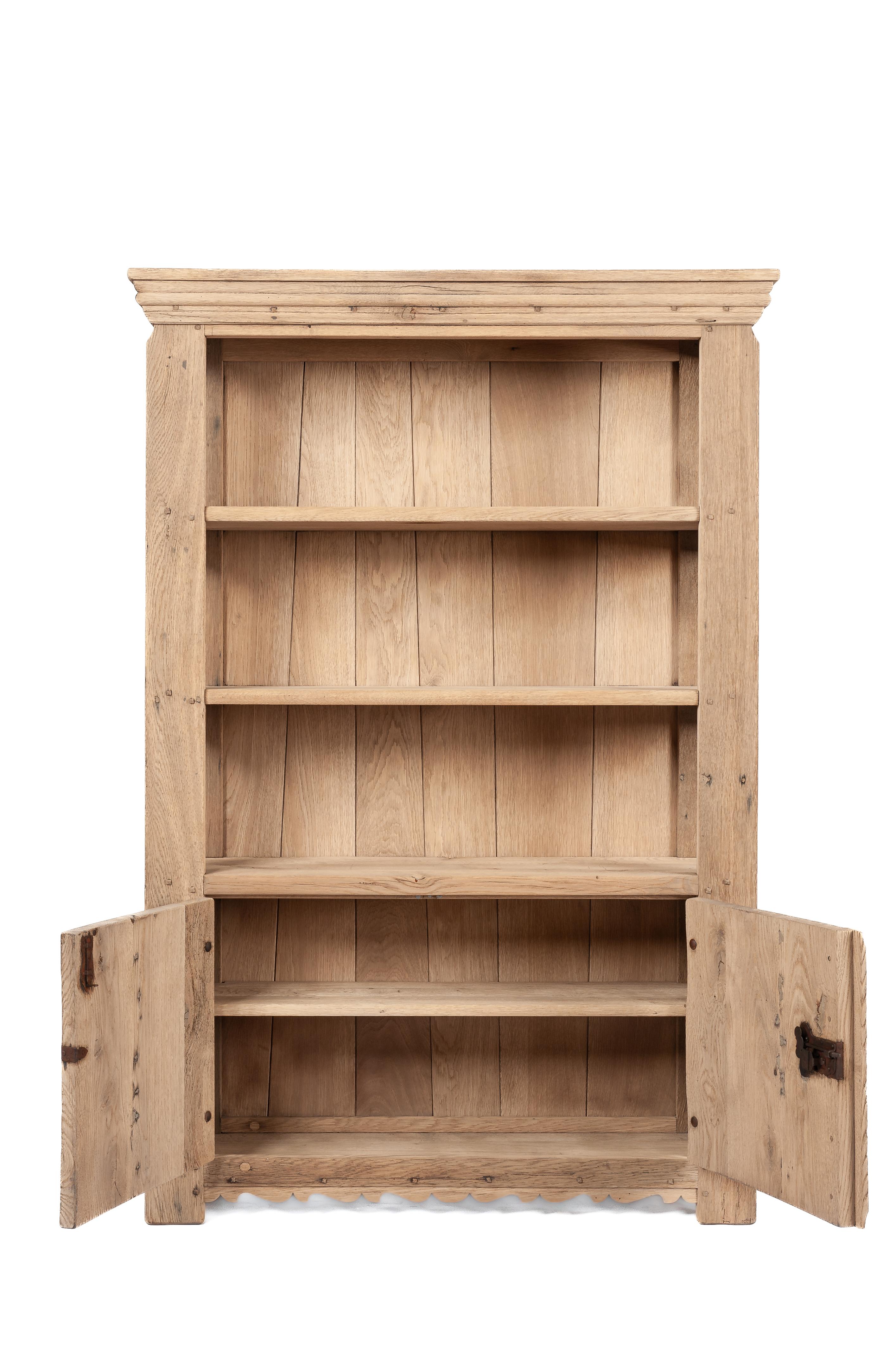 Dutch Vintage two-door stripped solid oak bookcase by Piet Rombouts & Sons, 1960s For Sale