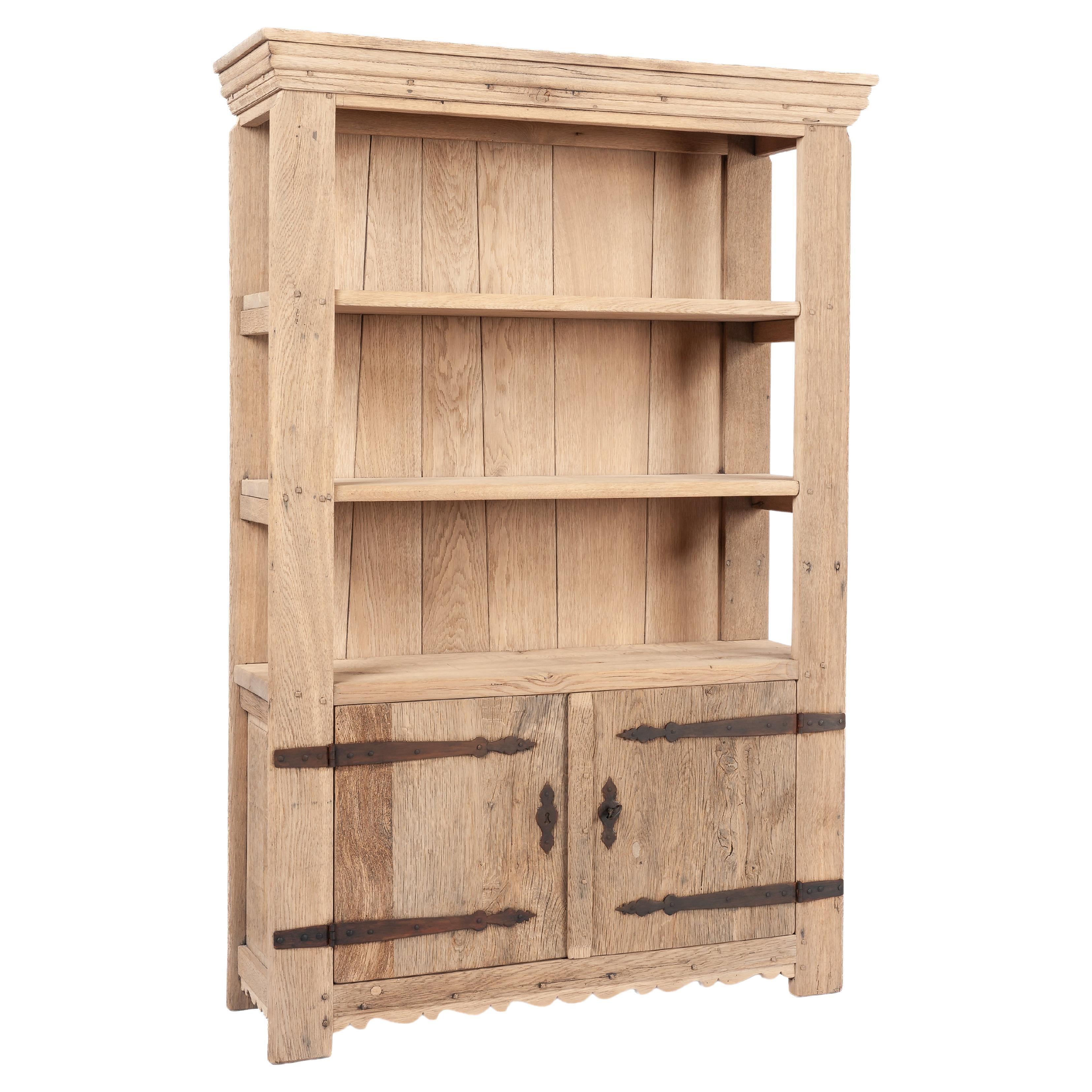 Vintage two-door stripped solid oak bookcase by Piet Rombouts & Sons, 1960s For Sale