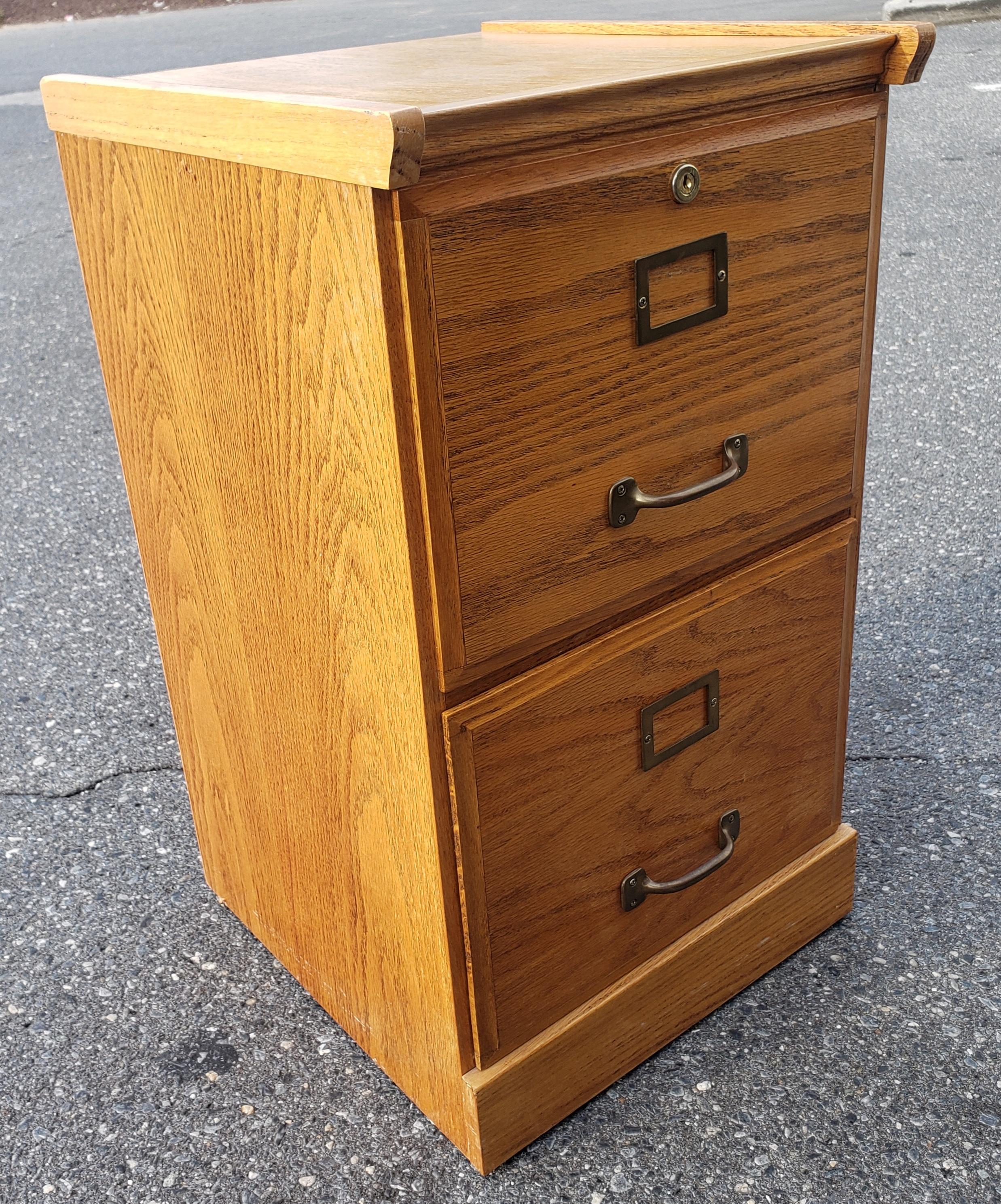 Attractive and useful are two words to describe this nice oak 2-drawer file cabinet. It has a beautiful oak finish with solid wood trims. The entire cabinet measures 16