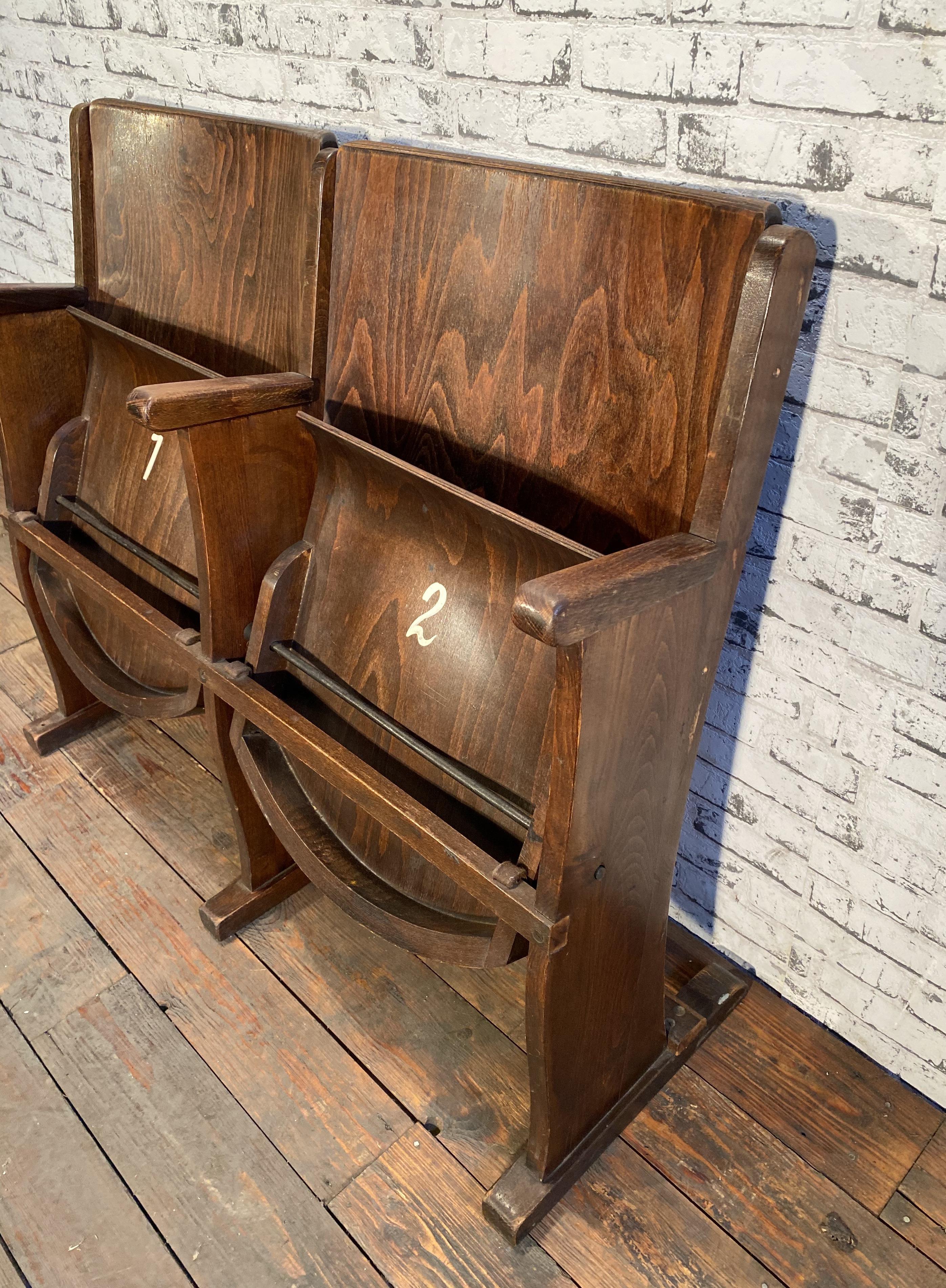 This two-seat cinema bench was produced by Ton (former Thonet) in Czechoslovakia during the 1950s. The chairs are stabile and can be placed anywhere. It is completely made of wood (partly solid wood, partly plywood). The seats fold upwards. The