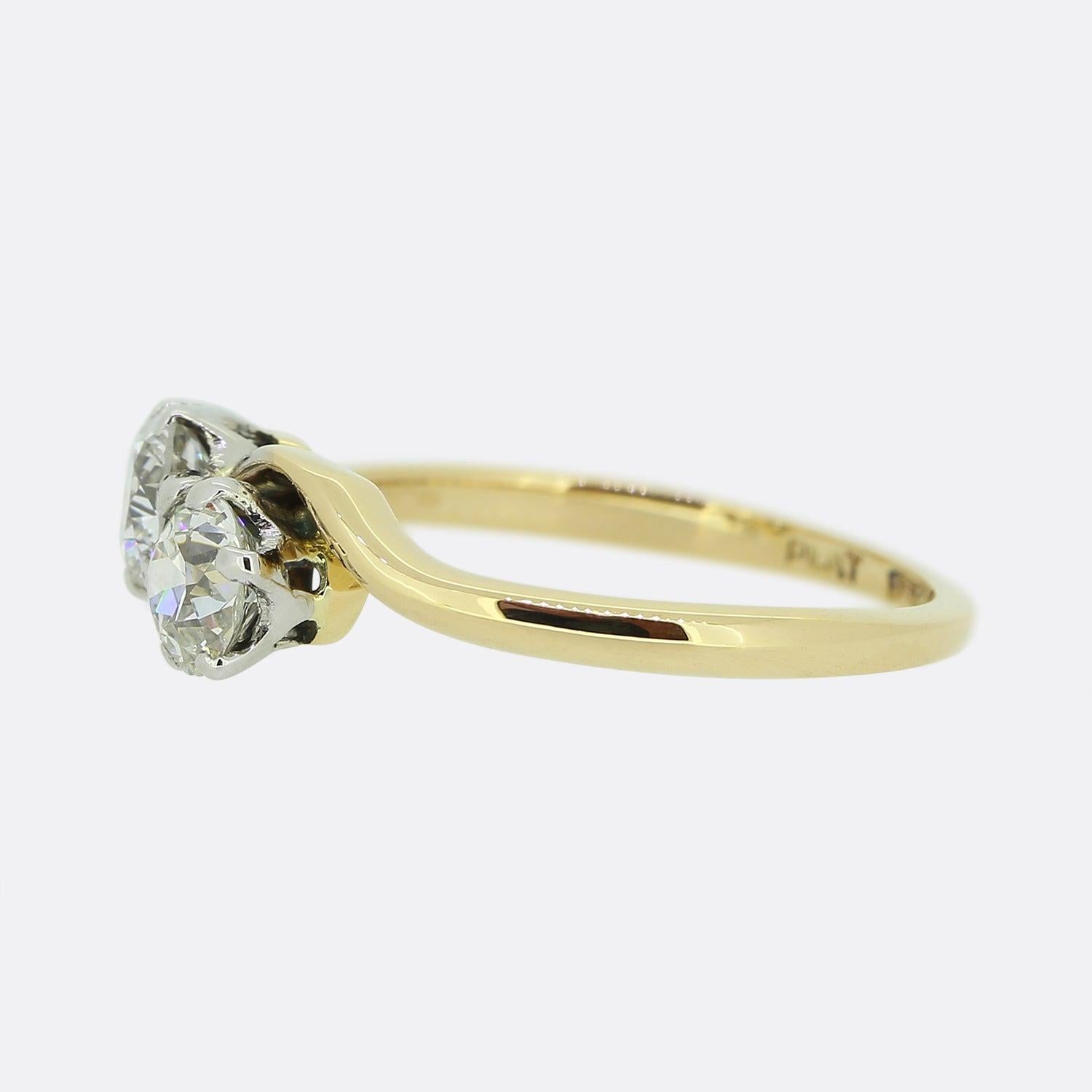 Here we have a classic two-stone diamond ring. This vintage piece has been crafted from 18ct yellow gold and showcases a duo of round faceted bright white natural diamonds in individual white gold six clawed settings. 

Condition: Used (Very