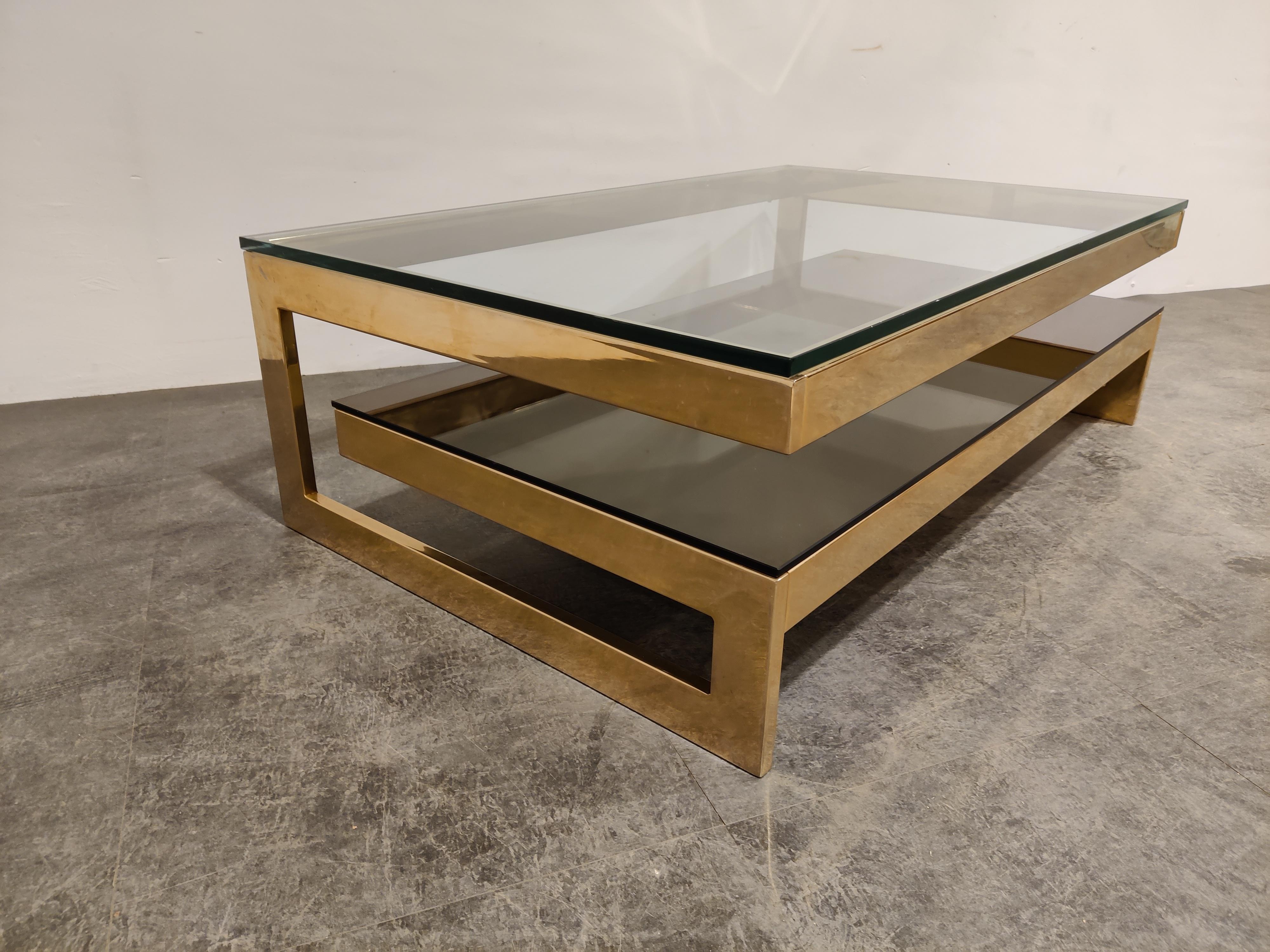 Quality 23-karat gold layered and thick clear glass two-tier coffee table manufactured by Belgochrom.

This table is a popular model and is referred to as the 'G' model

Belgochrom produced quality furniture pieces with a luxurious