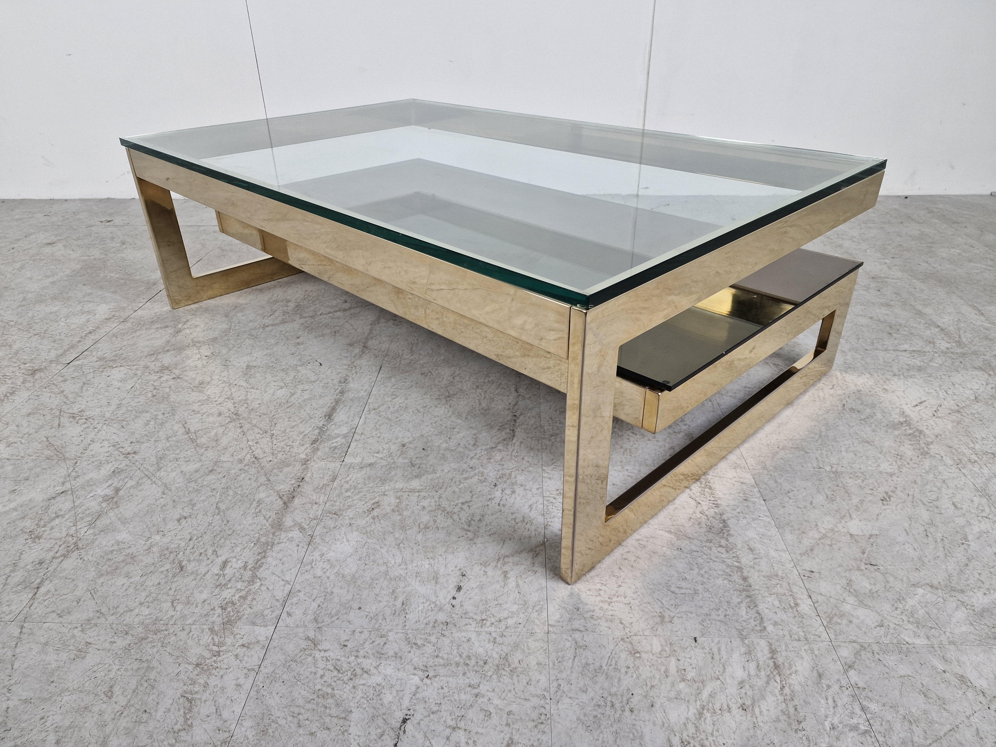 Quality 23kt gold layered and thick clear glass two tier coffee table manufactured by Belgochrom.

This table is a popular model and is referred to as the 'G' model

Belgochrom produced quality furniture pieces with a luxurious appeal.

Good