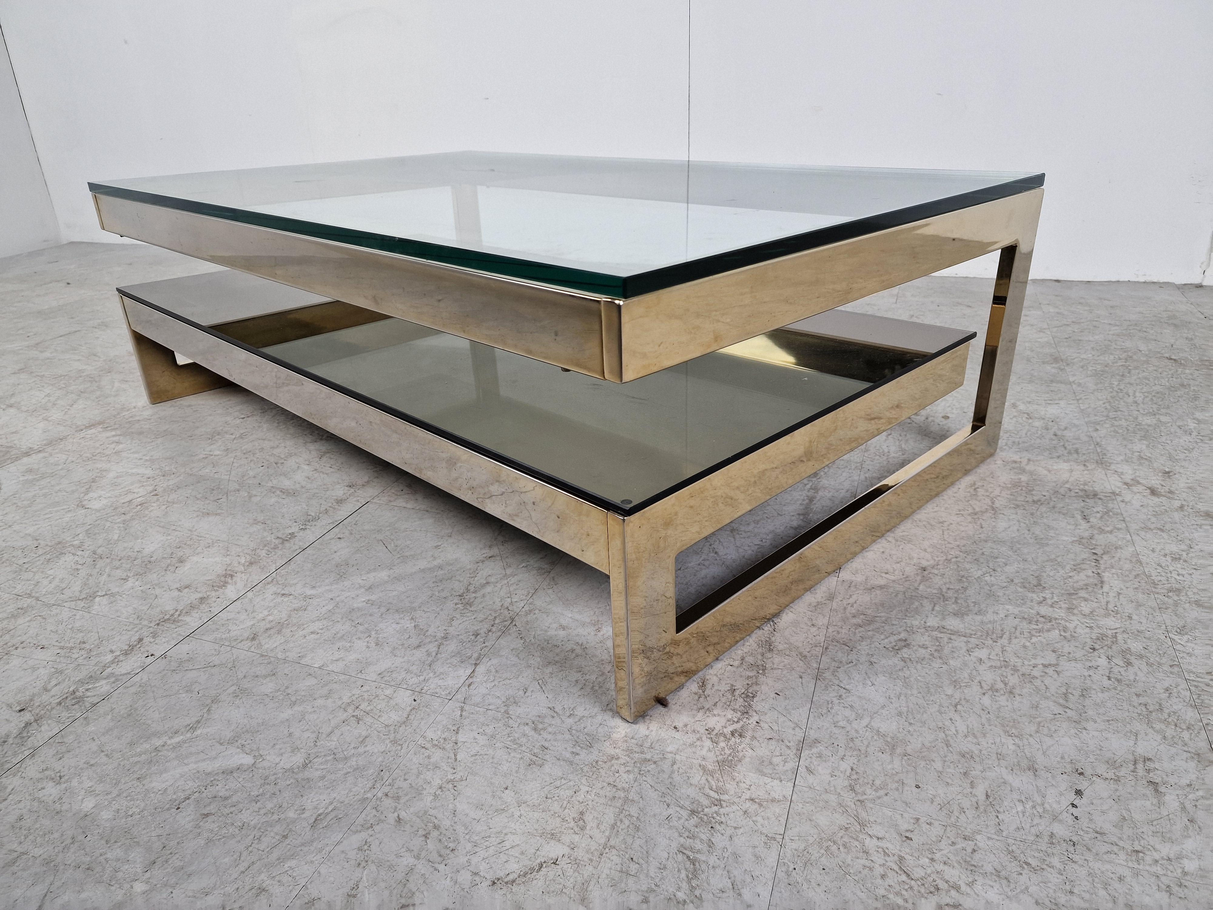 Quality 23kt gold layered and thick clear glass two tier coffee table manufactured by Belgochrom.

This table is a popular model and is referred to as the 'G' model

Belgochrom produced quality furniture pieces with a luxurious appeal.

Good