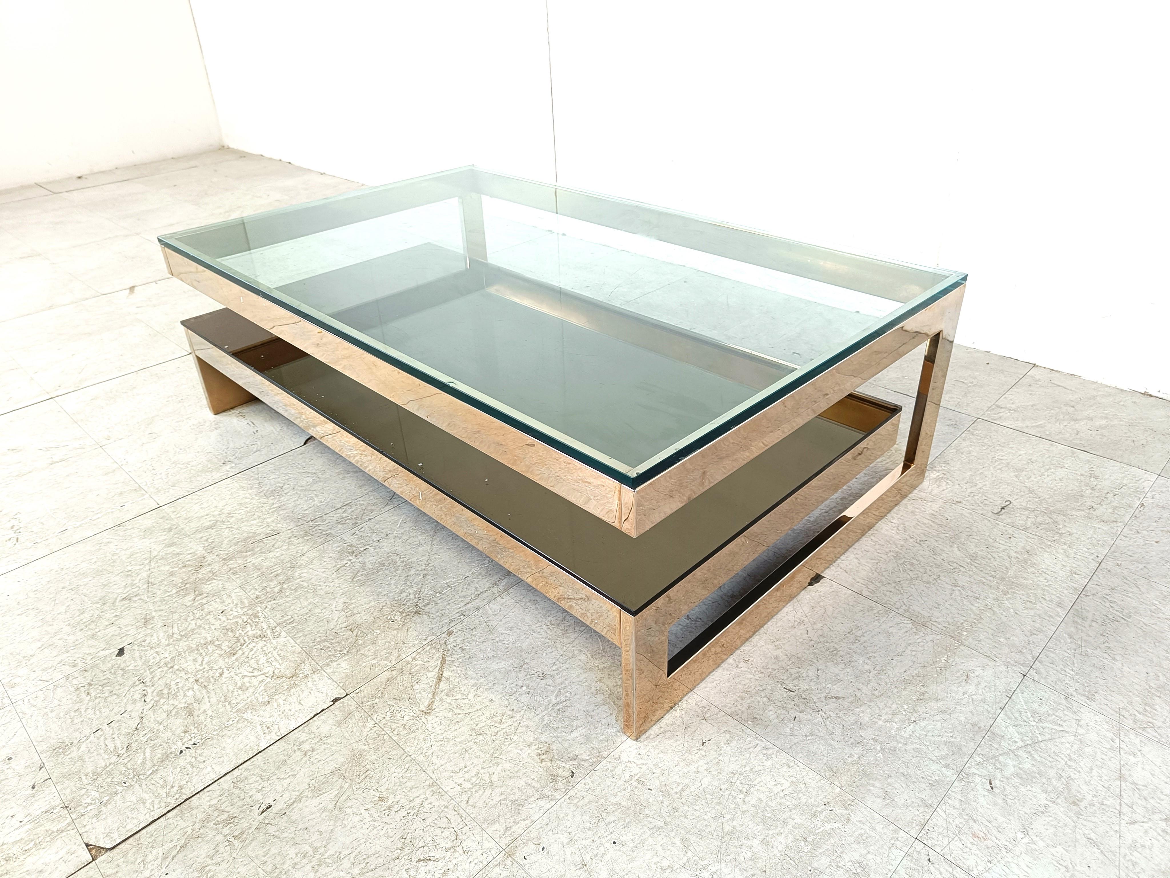 Quality 23kt gold layered and thick clear glass two tier coffee table manufactured by Belgochrom.

This table is a popular model and is referred to as the 'G' model

Belgochrom produced quality furniture pieces with a luxurious appeal.

Good overall