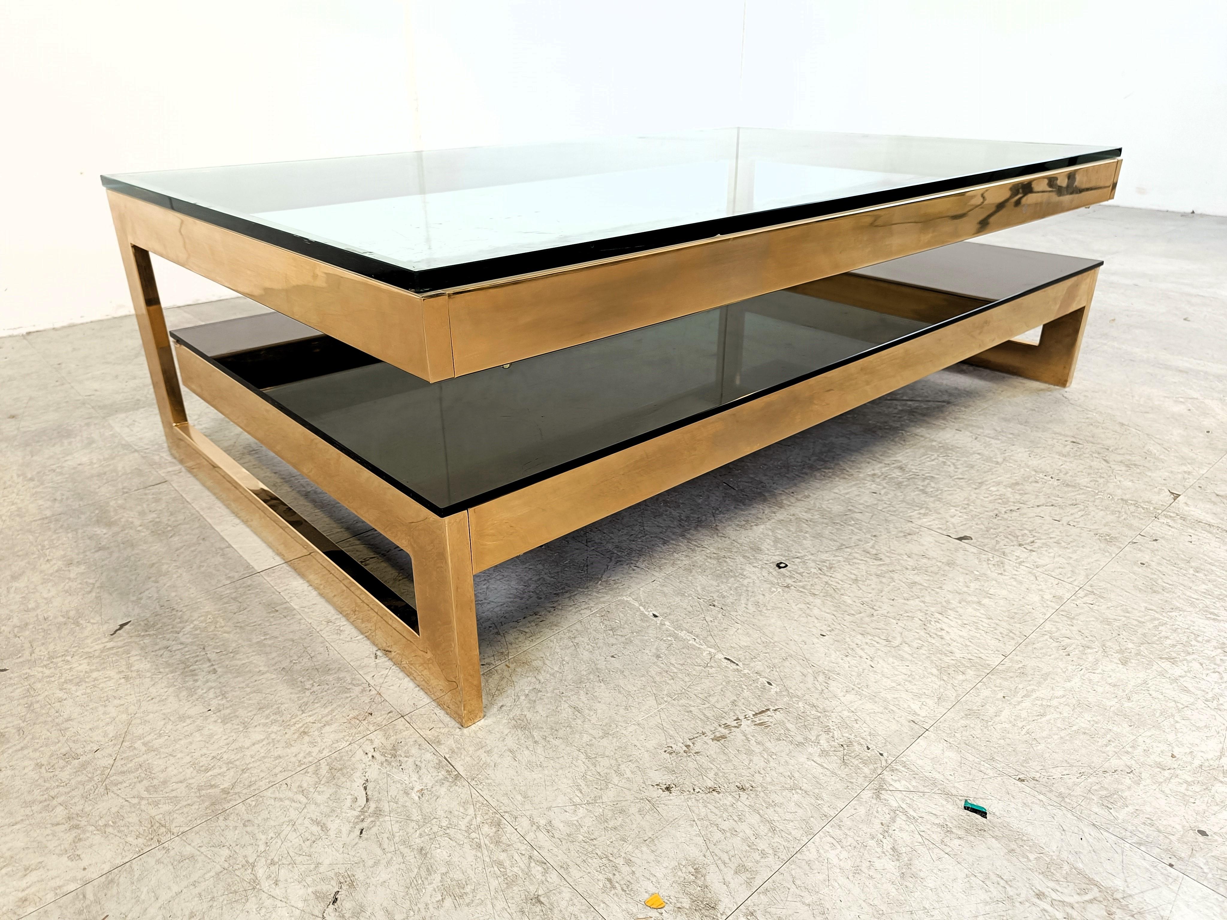 Quality 23kt gold layered and thick clear glass two tier coffee table manufactured by Belgochrom.

This table is a popular model and is referred to as the 'G' model

Belgochrom produced quality furniture pieces with a luxurious appeal.

Good overall
