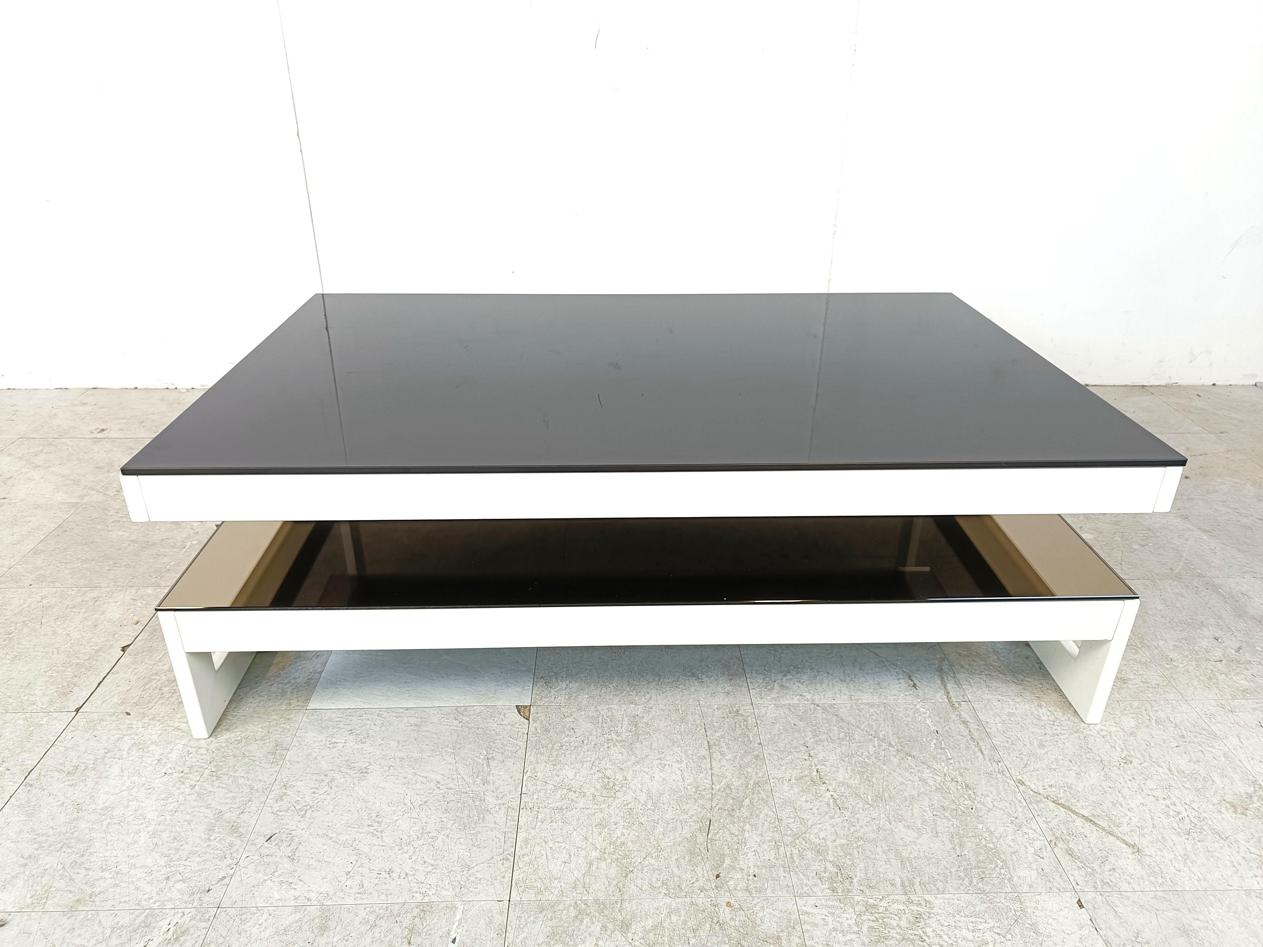 Very rare white lacquered metal two tier coffee table manufactured by Belgochrom.

Black glass top and mirrored lower glass.

Mostly these are 23kt gold layered, but this is a very rare factory white model.

Referred to as G coffee table

Belgochrom