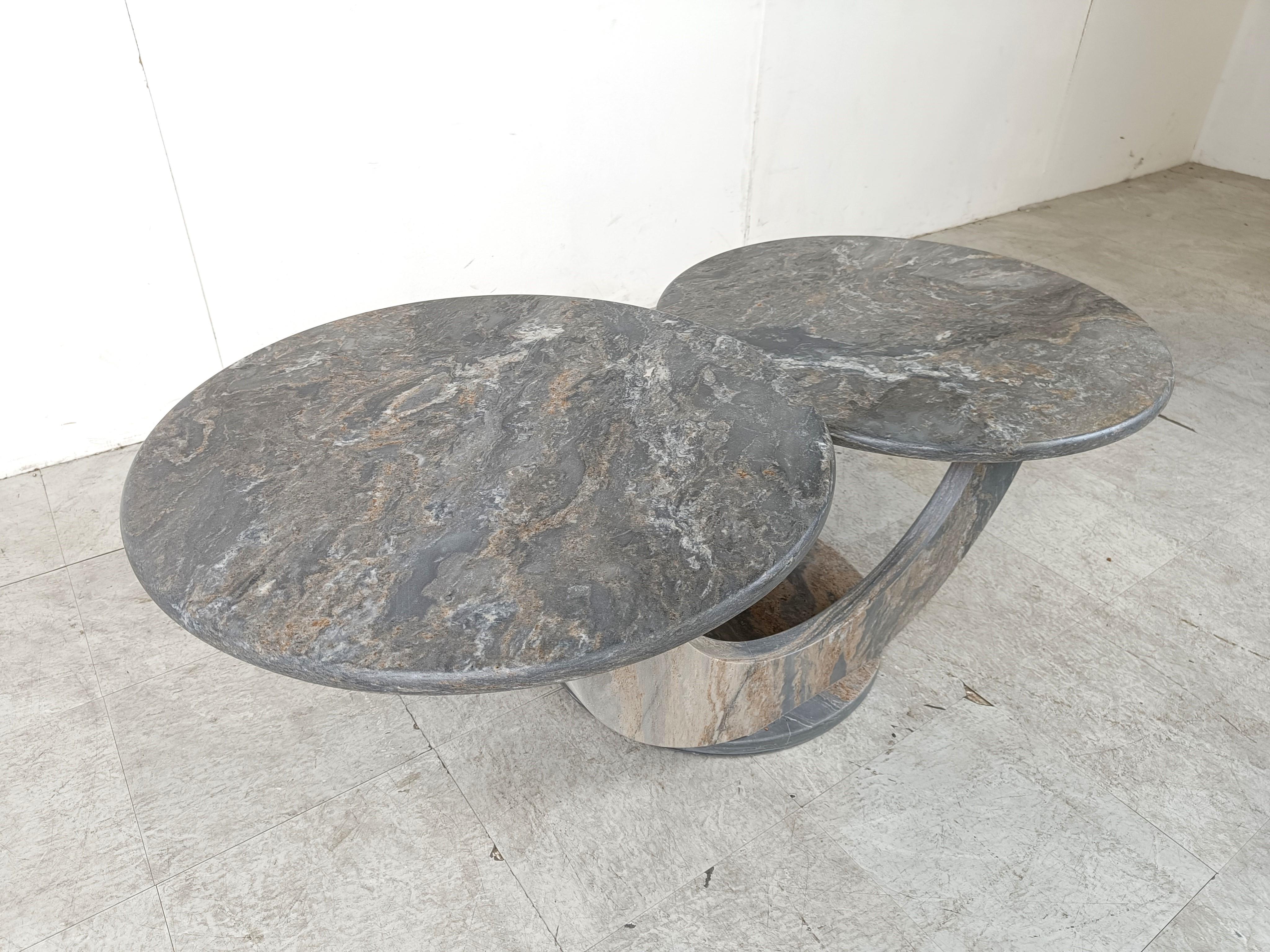 Timeless marble coffee tables with two round tops.

Beautiful arched base and attractive natural vains in the stone.

Good condition.

1970s - Italy

Dimensions:
Height: 42cm/16.53