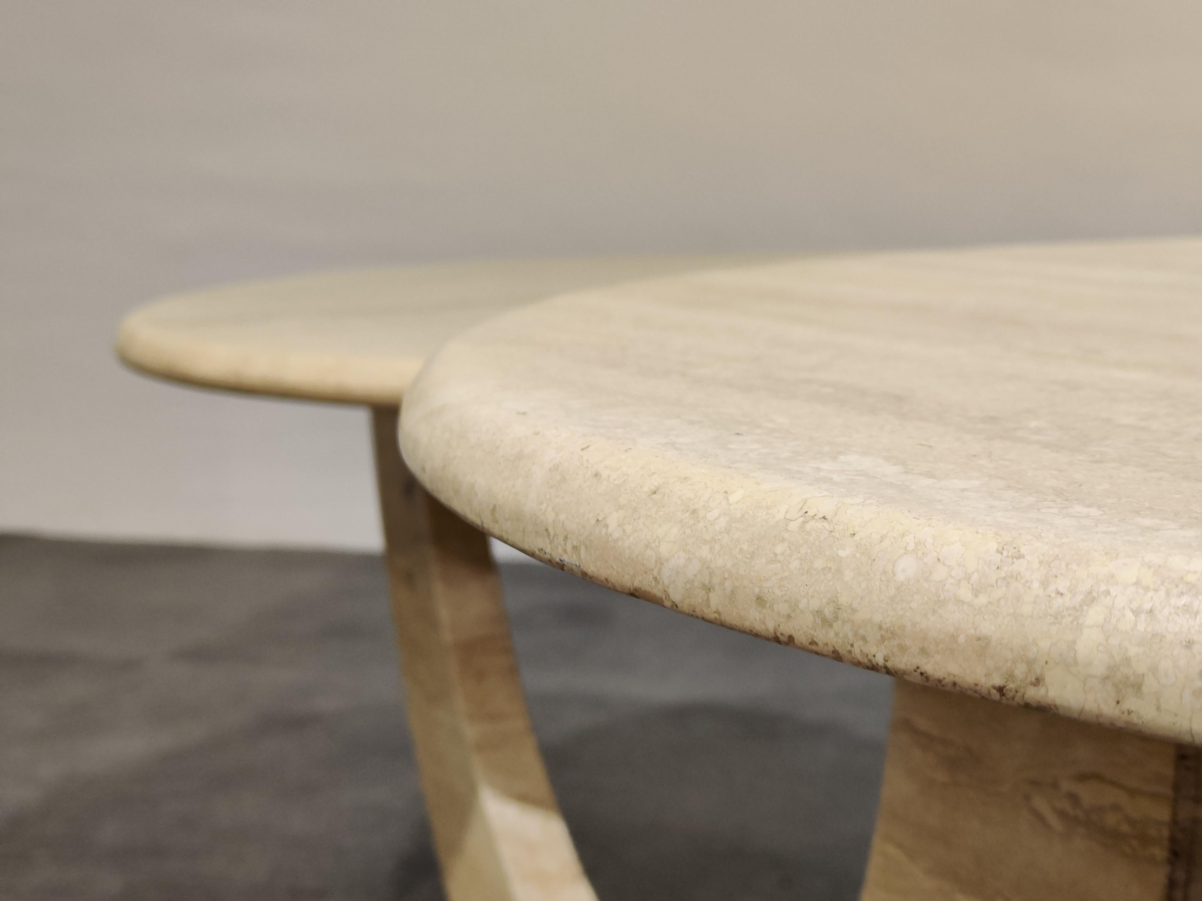 Timeless travertine coffee tables with two round tops.

Beautiful arched base.

Good condition.

1970s, Italy

Dimensions:
Height 42cm/16.53