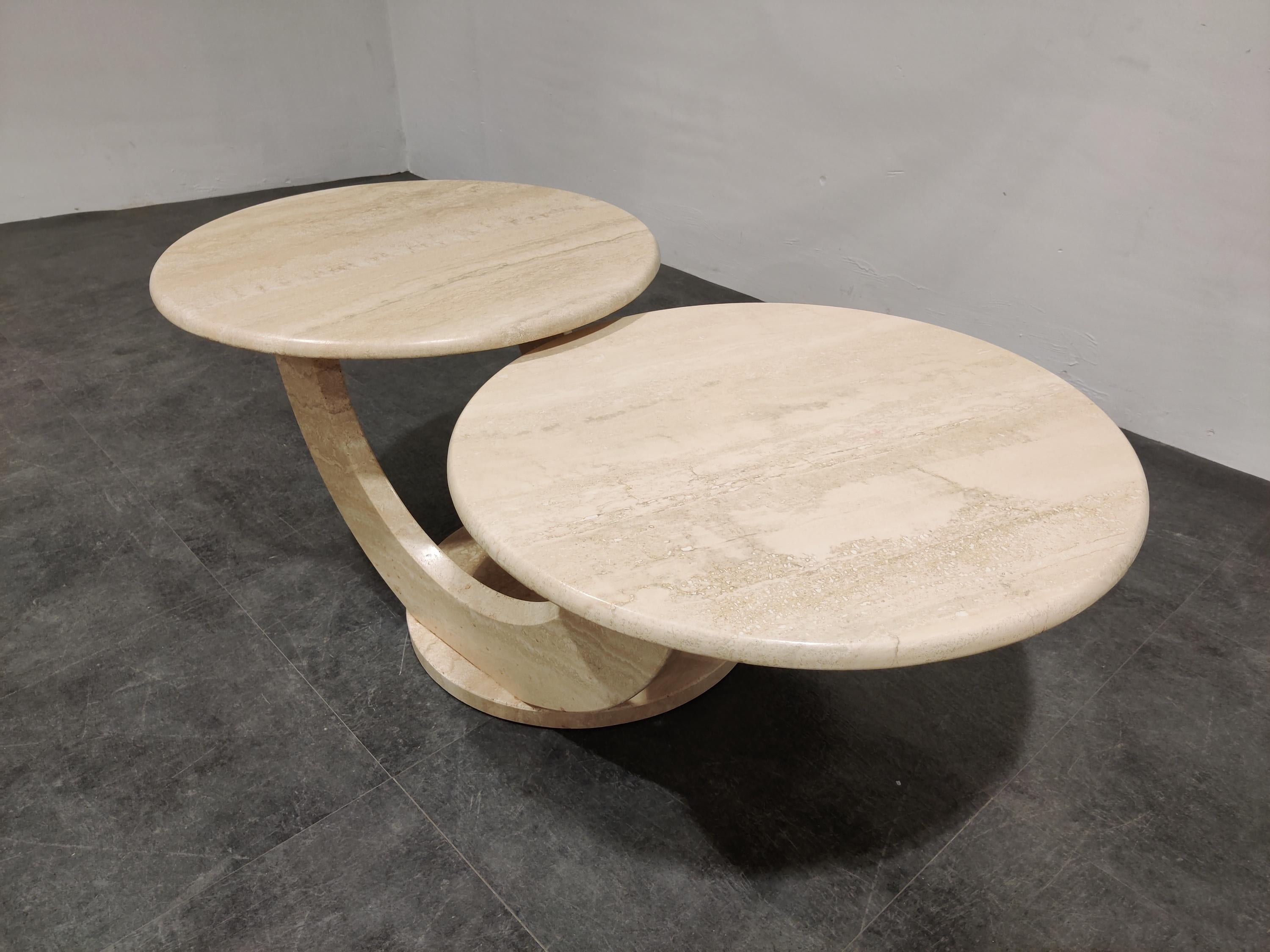 Timeless travertine coffee tables with two round tops.

Beautiful arched base.

Good condition.

1970s - Italy

Dimensions:
Height: 42cm/16.53