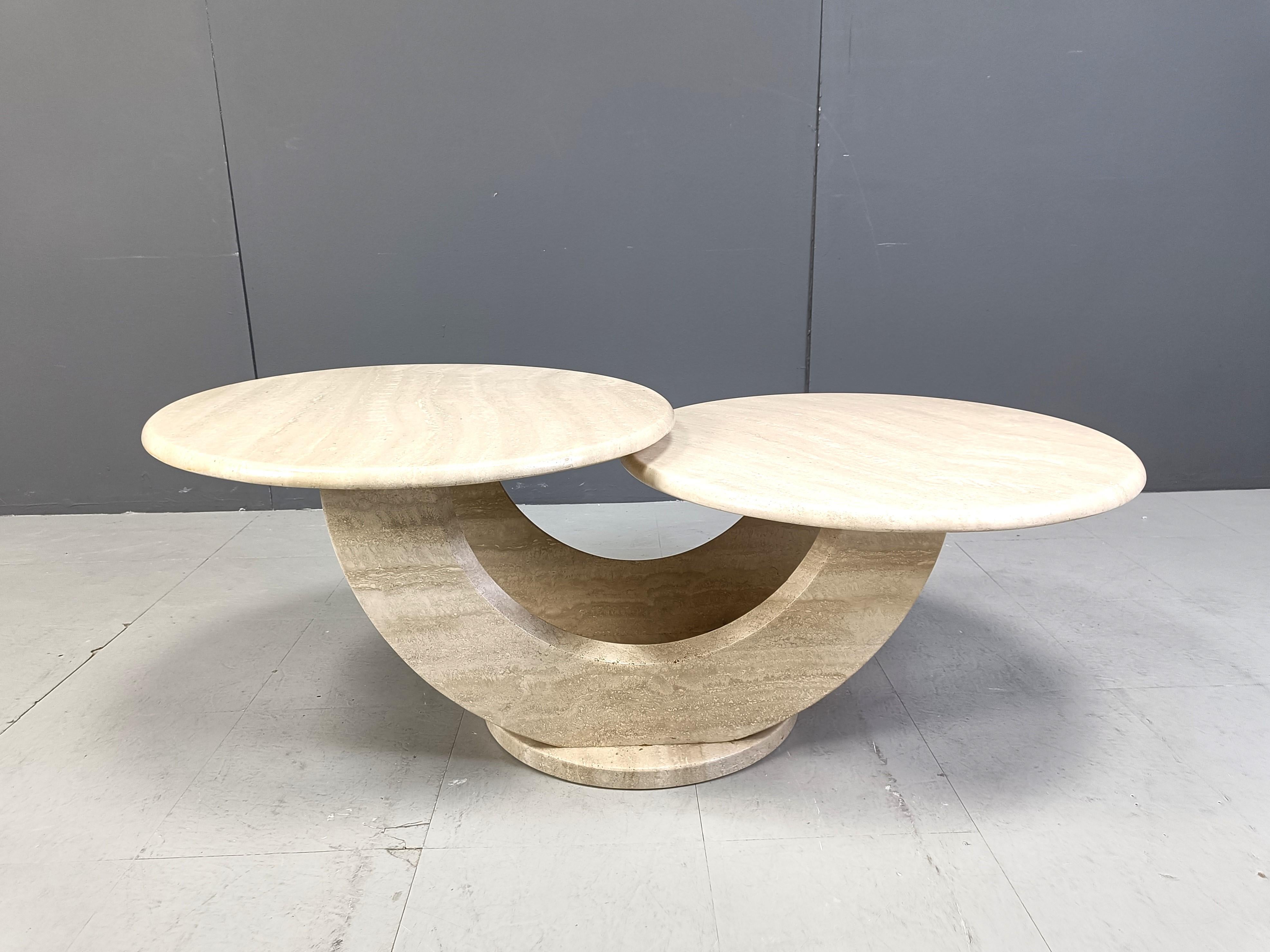 Timeless travertine coffee tables with two round tops.

Beautiful arched base.

Good condition.

1970s - Italy

Dimensions:
Height: 44cm
Lenght: 120cm
Depth: 65cm

Ref.: 24102115
*Images are part of the description