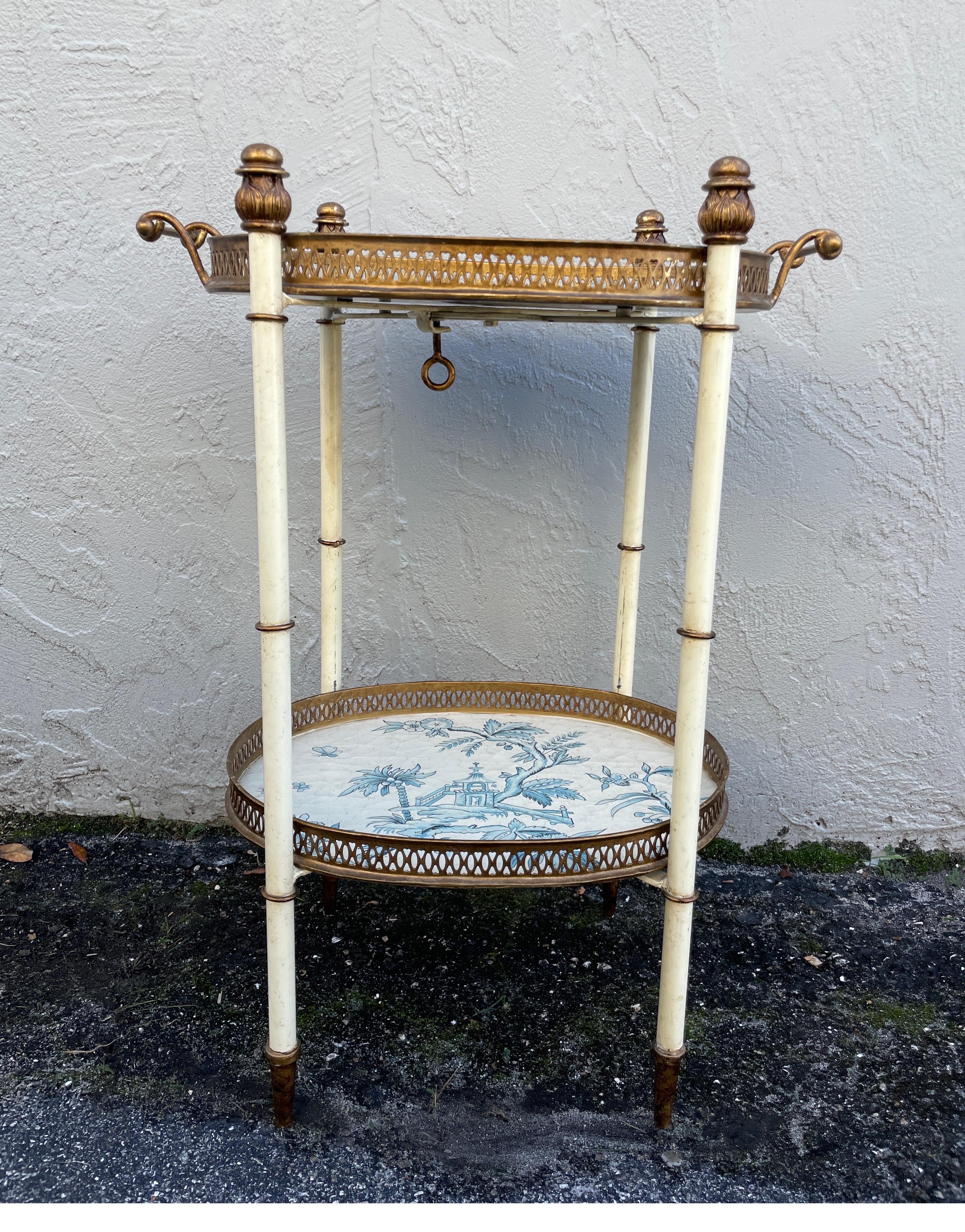Beautiful two-tiered Chinoiserie design tray table in blue and cream. This piece would look good anywhere. It's just very special.