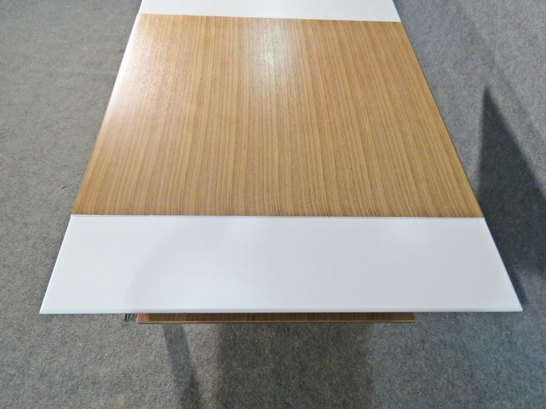 Mid-Century Modern coffee table combining rich woodgrain with white panels in an elegant design. A bottom tier allows for extra storage of magazines or books and makes this table a stylish and functional element of any living room. Please confirm