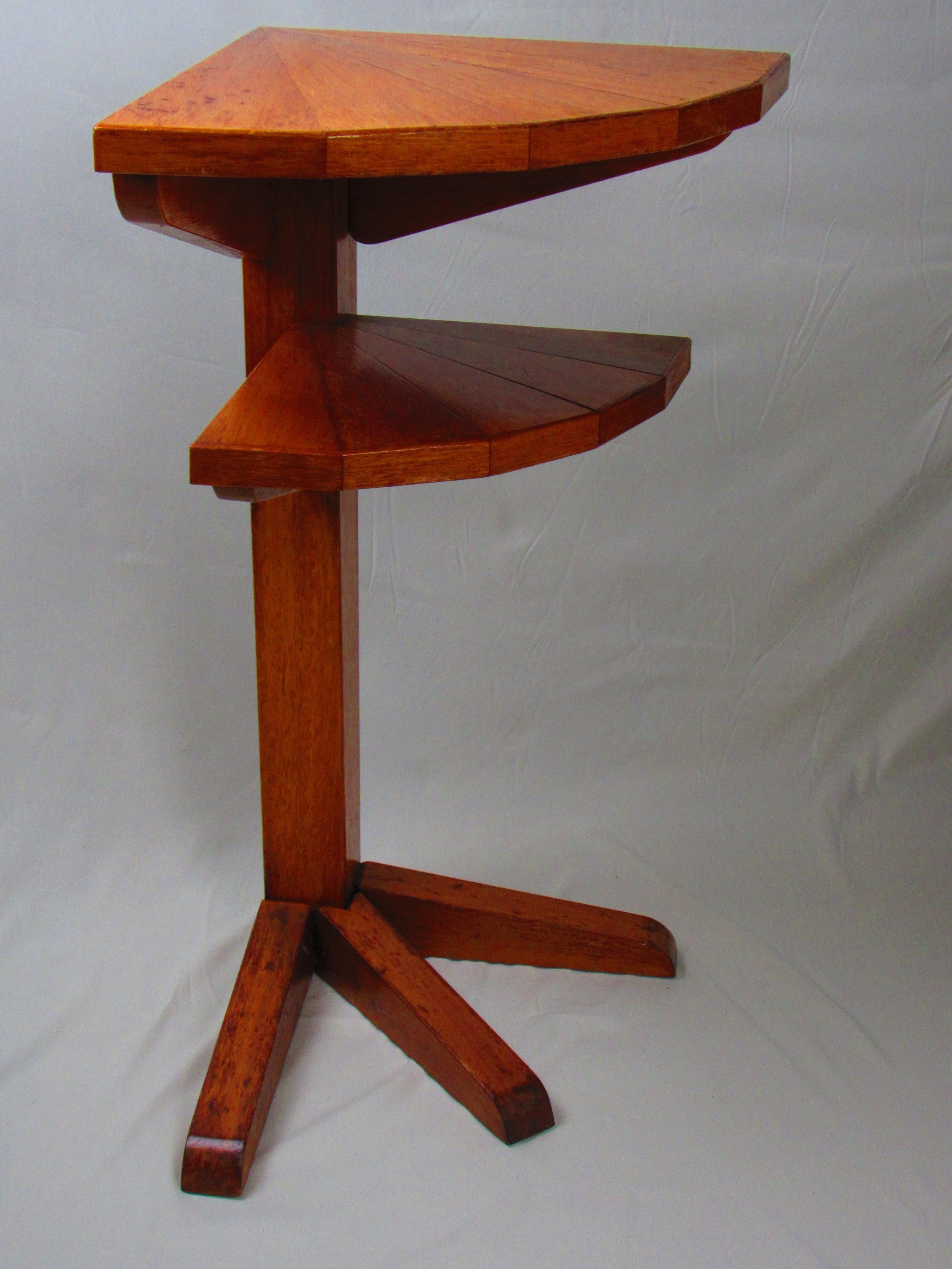 Bring vintage elegance into your home with this beautifully crafted two-tiered oak wooden drink table. Designed to fit perfectly into a corner, this space-saving piece offers both style and function. The striking straight leg, supported by three