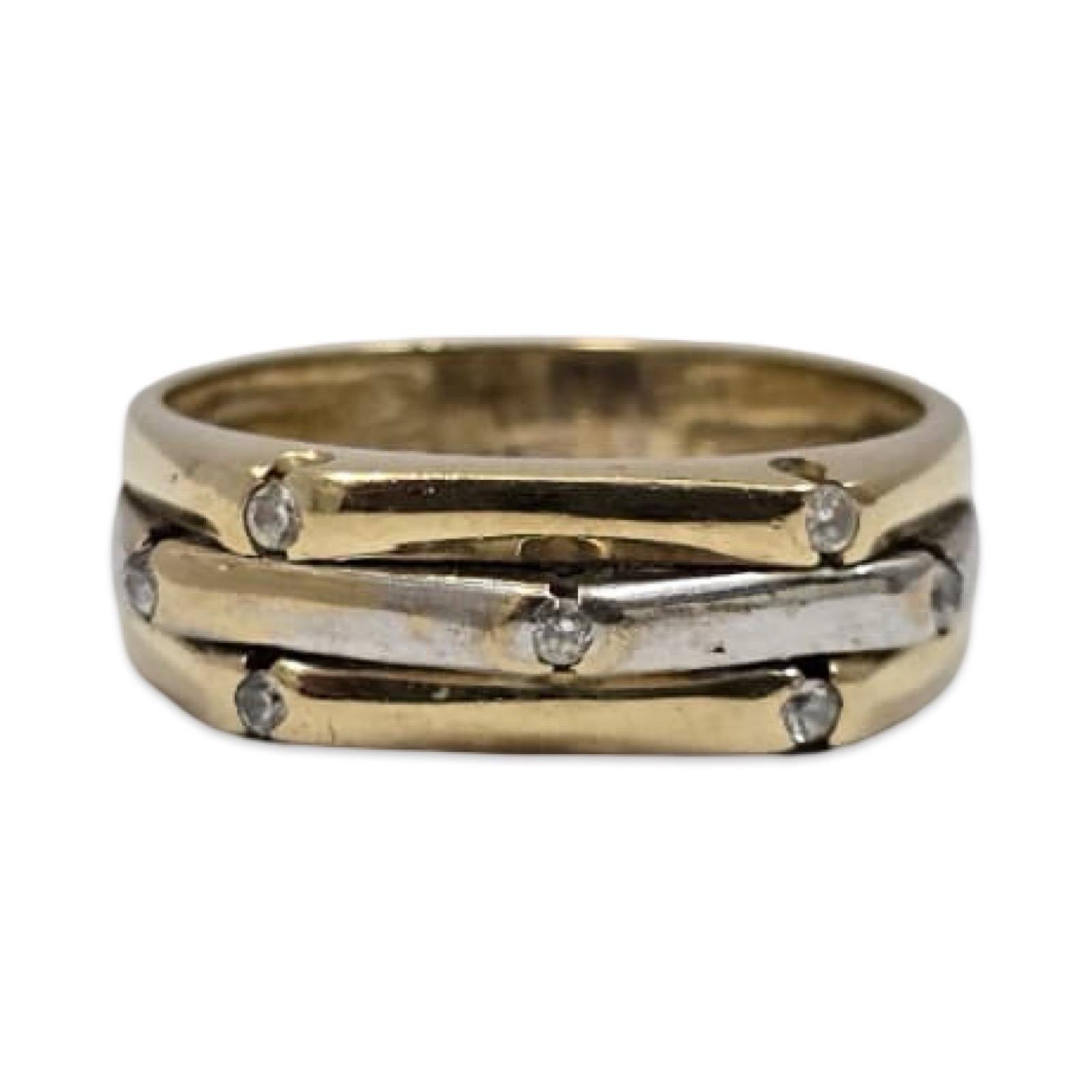 A vintage two-tone 14K gold band designed with three sculptural, interwoven bars of yellow and white gold, each accented with a sparkling diamond. The pattern creates a layered, architectural look with diamonds placed at the ends of each bar for a