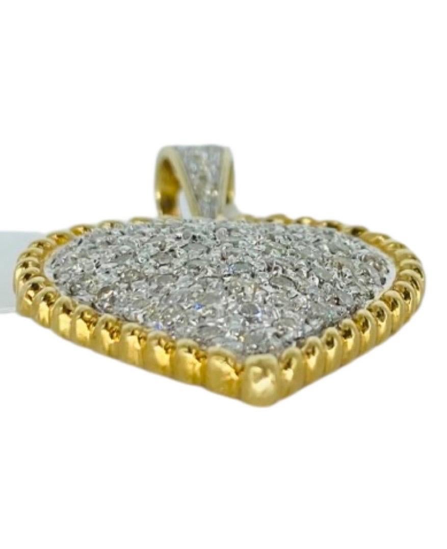 Vintage Two-Tone 1.50tcw Diamonds Heart Shaped Pendant 14k Gold. Beautiful pendant with rope design frame and sparkly diamonds natural weighting approx 1.50 carat in total. The diamonds featured are approx G-H/VS+ 
The pendant measures 30mm X 21.5mm