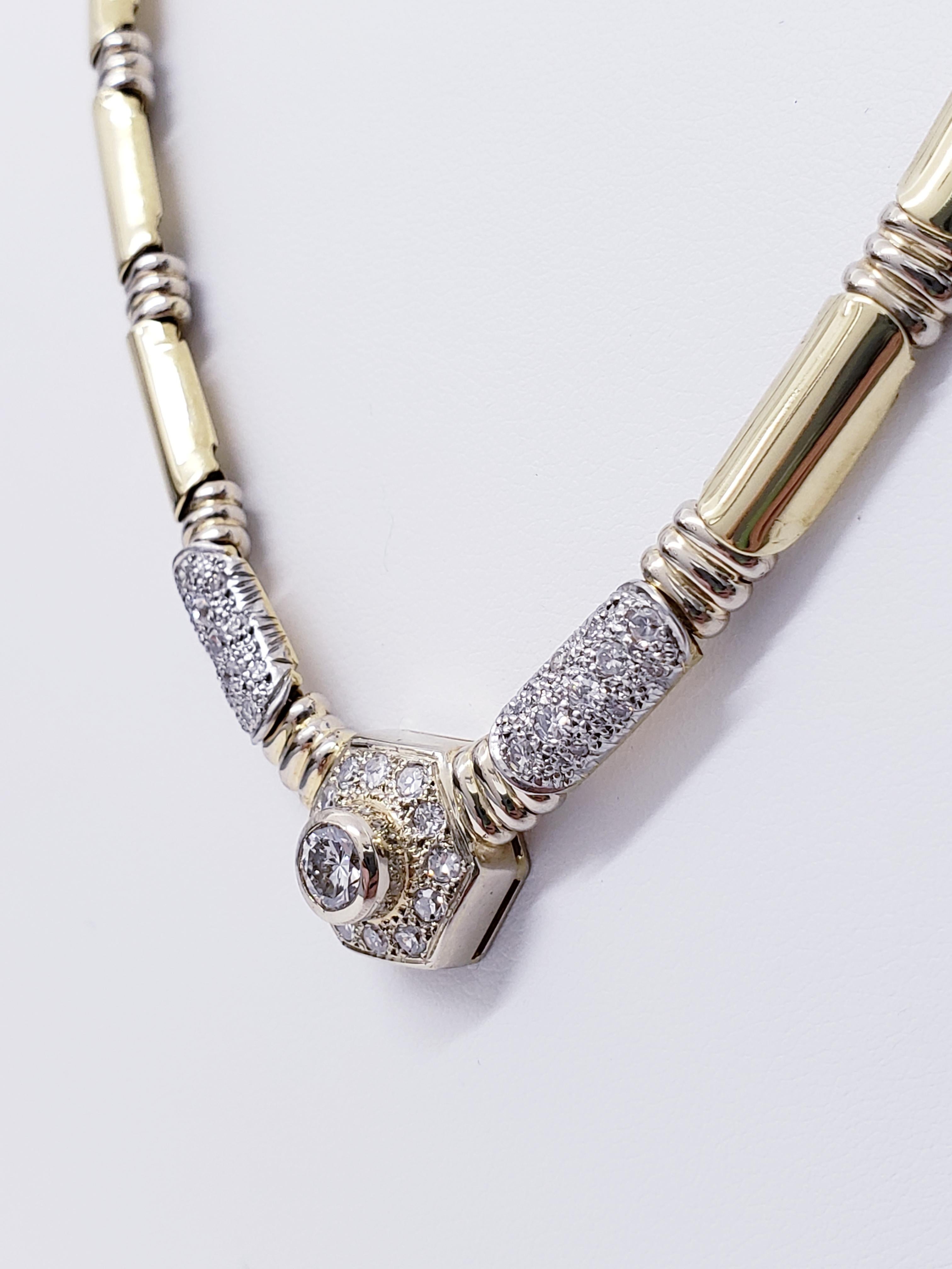 Vintage 4.00tcw Diamant-Bambus-Halskette
Die Halskette hat ein schönes Bambusdesign mit Gelb- und Weißgold, um mehr Details des Bambus zu zeigen. Der Diamant in der Mitte wiegt ca. 0,50ct und die seitlichen Diamanten insgesamt ca. 3,50ct. Die