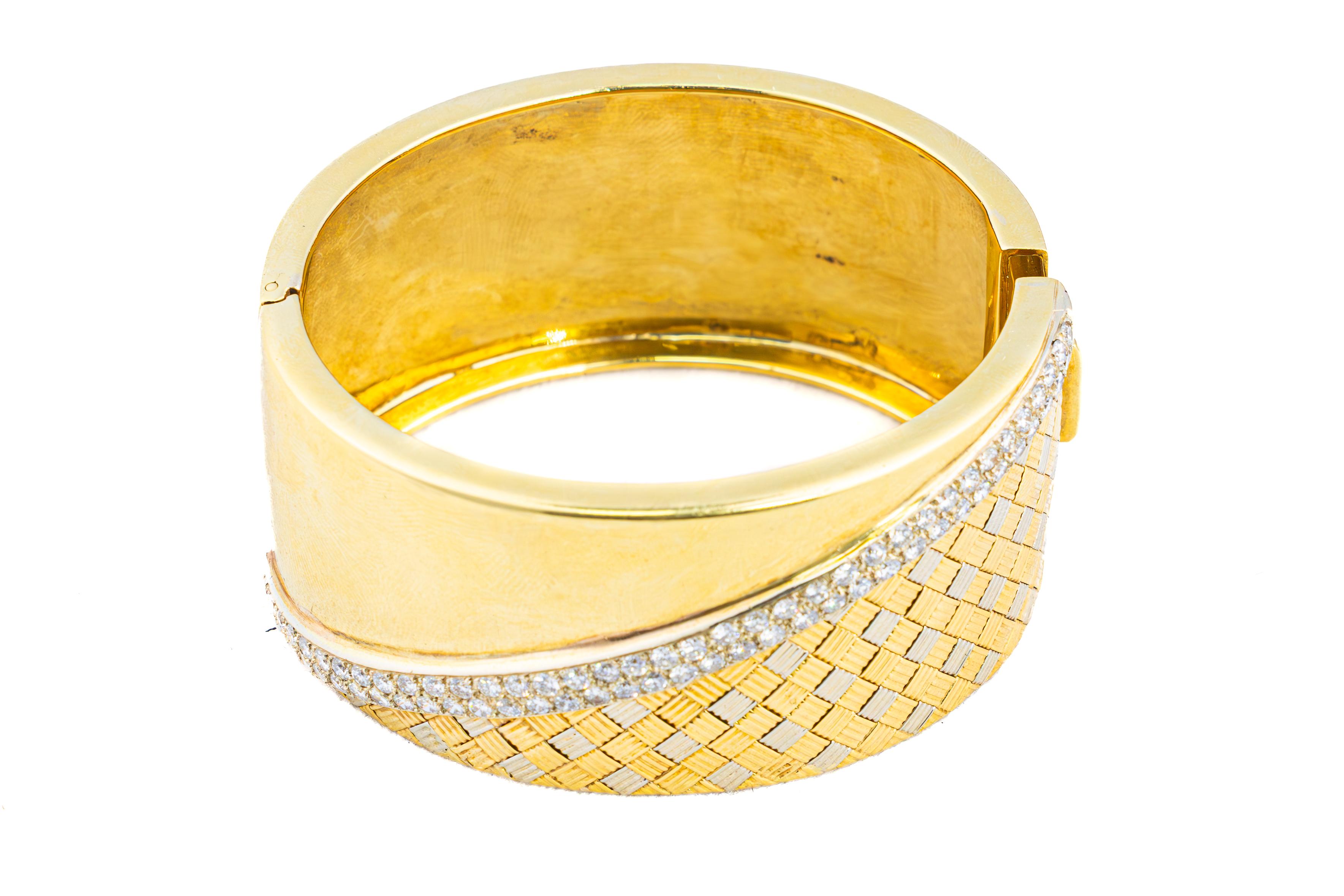 Vintage Two-Tone Diamond Woven Gold Bangle Bracelet

This stunning bracelet is crafted in a harmonious combination of 18-karat yellow and white gold, presenting a bold and elegant design. The diamonds are meticulously arranged in diagonally striped