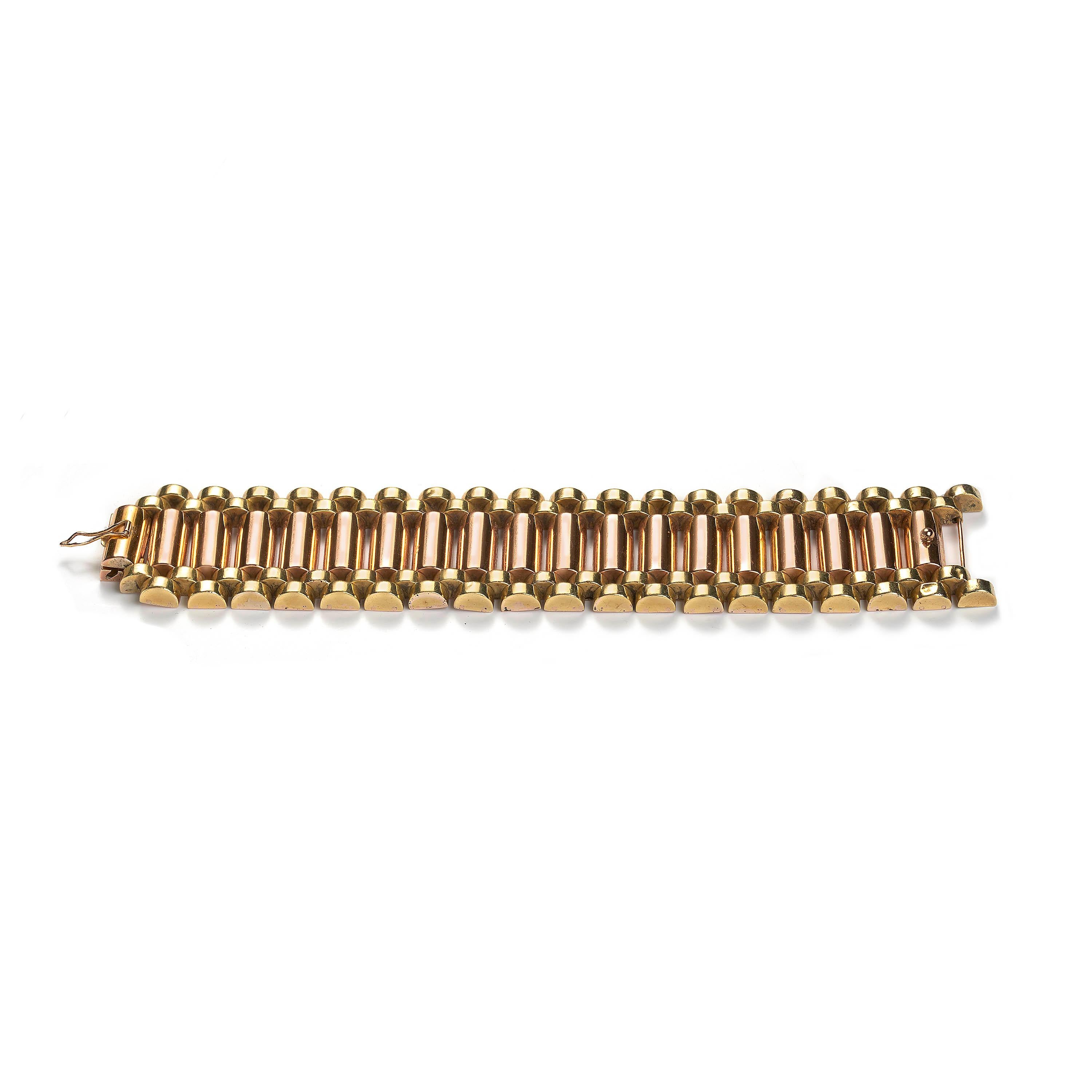 A vintage gold bracelet, consisting of a central row of rose gold cylindrical links, flanked by yellow gold, cylindrical brick-style links to either side, all mounted in 18ct gold. Circa 1940.