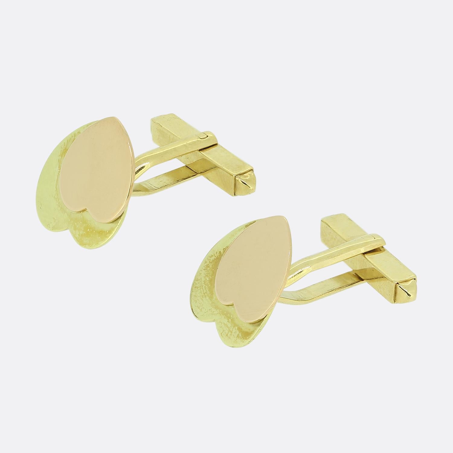 Here we have a vintage a pair of two-tone heart cufflinks consisting of an 18ct rose gold heart face atop top of a larger 19ct yellow gold heart acting as the backdrop. 

Condition: Used (Good)
Weight: 9.2 grams
Face Dimensions: 14mm x