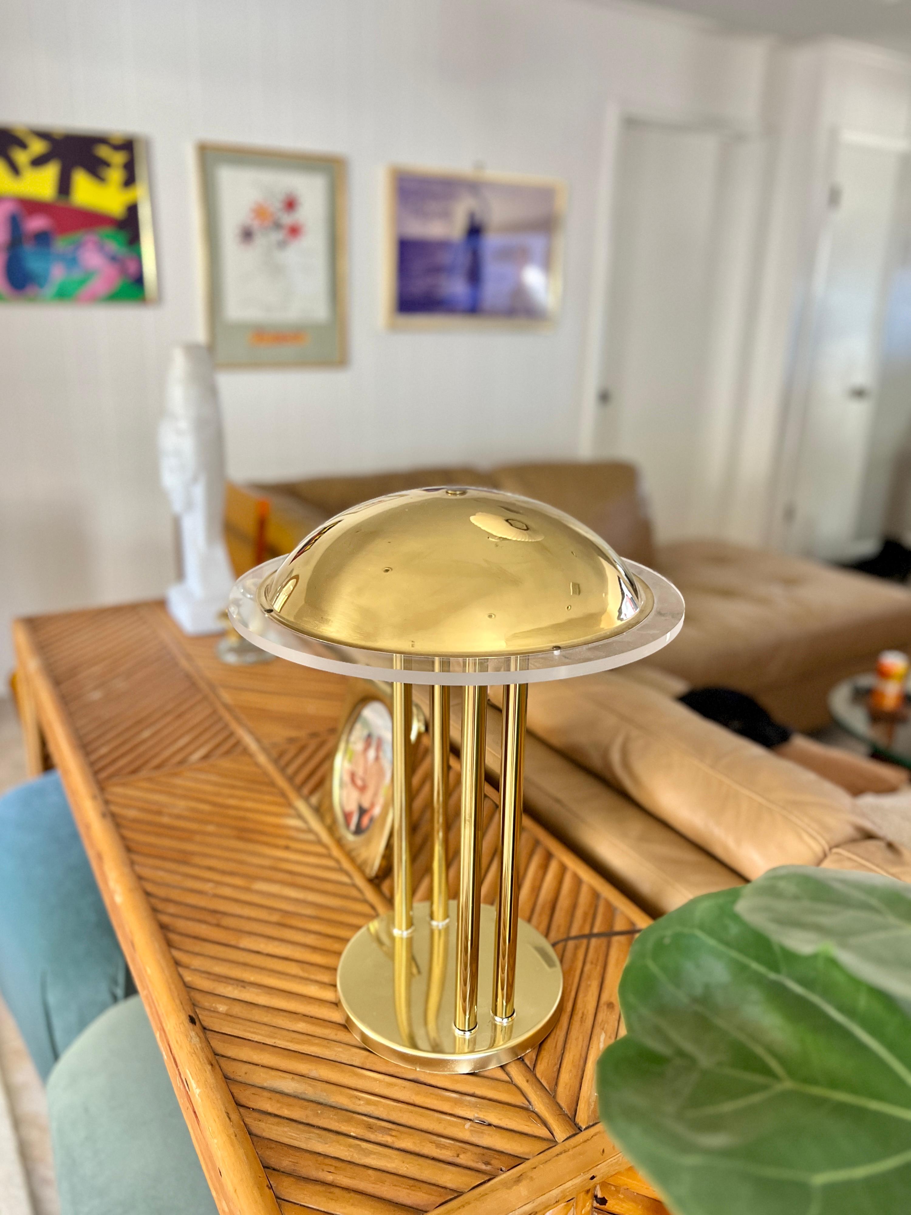 Vintage UFO lamp with lucite detail around the shade, circa 1970s-1980s. In very good working condition with some minor cosmetic flaws on the surface as seen in photos. 

18” H x 14” W 