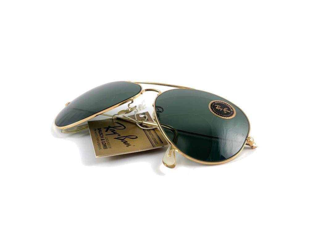 New Super special vintage Ray Ban Aviator Gold frame with B&L G15 Grey Lenses in SIZE 64mm !! Largest size ever made.
Comes with its original Ray Ban B&L case. 
Rare and hard to find in this new, never worn or displayed condition. This item show