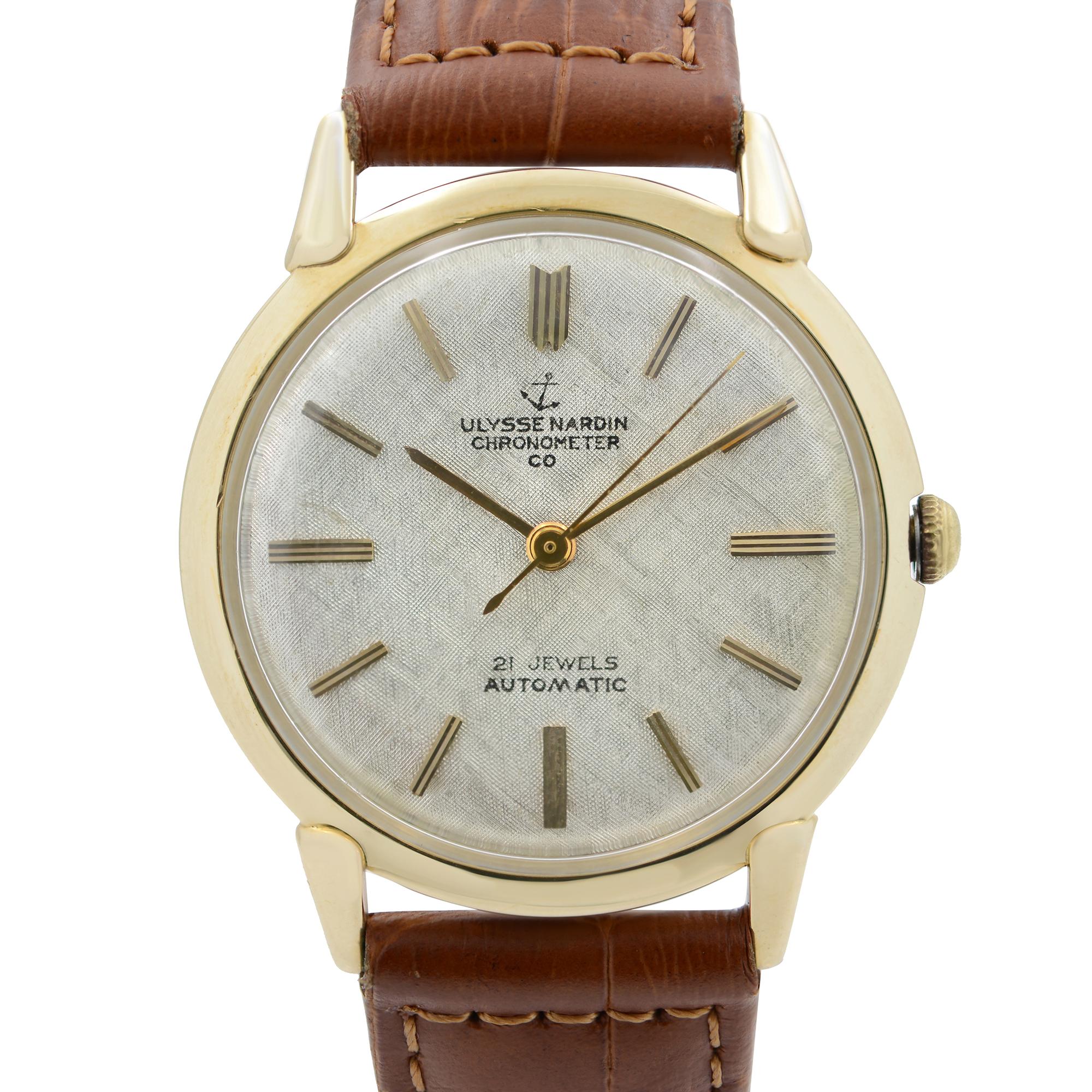 Pre Owned Vintage Ulysse Nardin 34 mm 14k Yellow Gold Saddle Leather Automatic Men's Watch. Aftermarket Band and buckle. this Beautiful Timepiece is Powered by Mechanical (Automatic) Movement And Features: Round 14k Gold Case and  Bezel, Silver