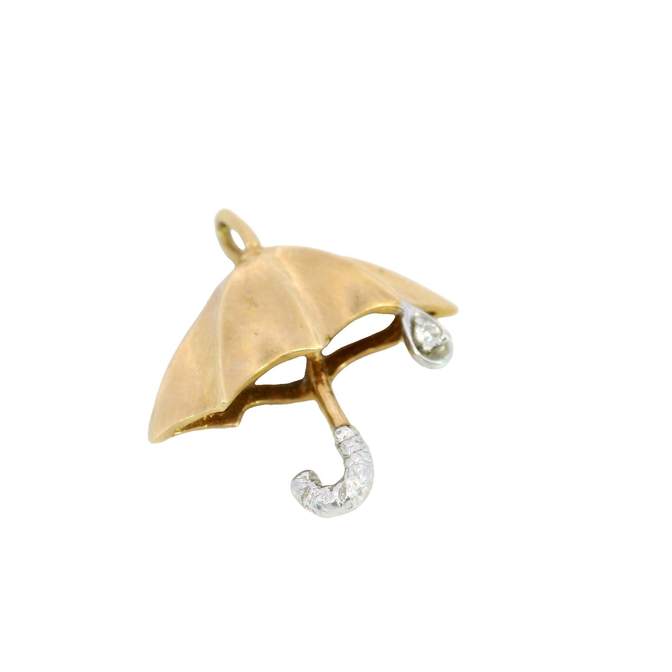 Vintage Umbrella Diamond Charm Pendant 14 Karat Yellow Gold

This Vintage Umbrella Charm Pendant is a delightful addition to any jewelry collection. Made in 14K yellow gold, the pendant features a charming umbrella design with a graceful curve and