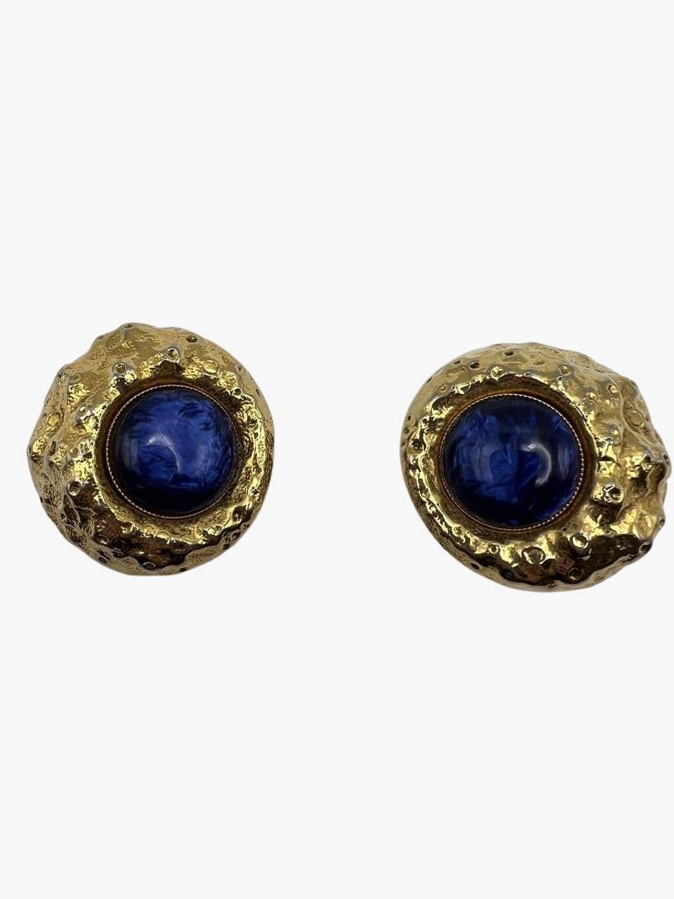 Vintage oversized gold tone clip-on earrings embedded with blue cabochon. 
Signed. 
Period: 1990s
There is also inscription 