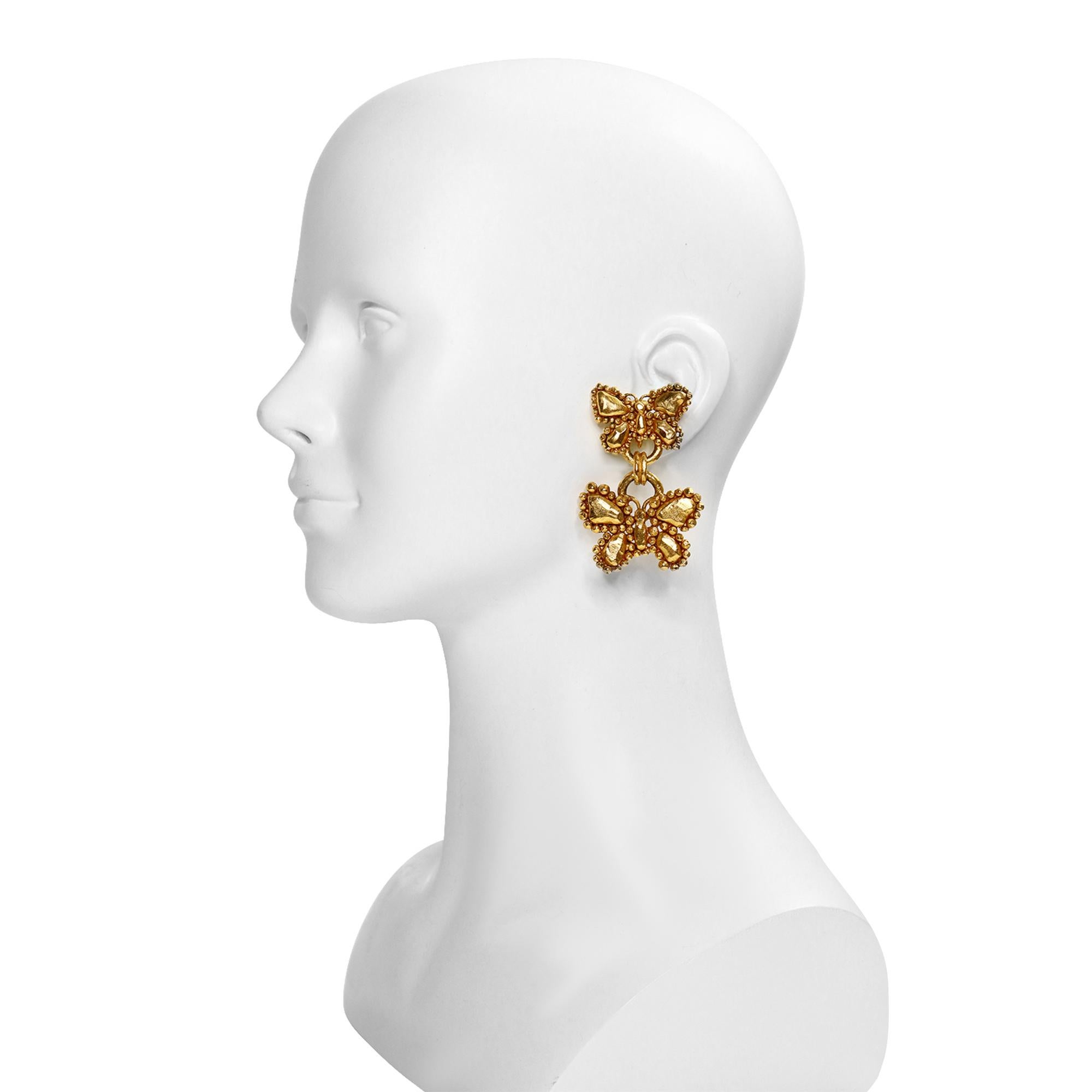 Vintage Ungaro Gold Dangling Butterfly Earrings Circa 1980s. These are double earings of a smaller and then larger butterfly.  They are so chic and will make any outfit look put together and chic. Clip on. 

They really don't make costume jewelry