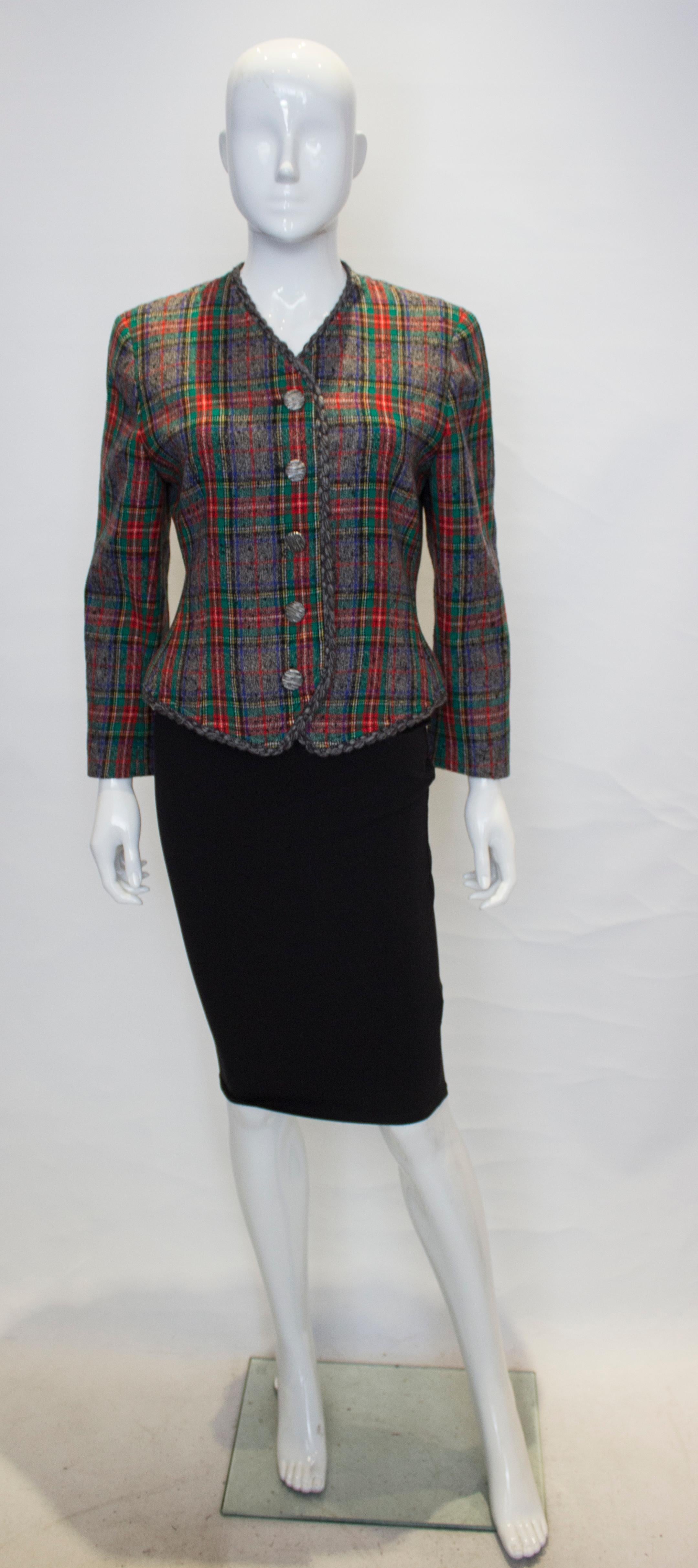 A great jacket by Ungaro, Solo Donna line. The jacket is wool in a grey check, with a grey wool braid and a five button fastening.