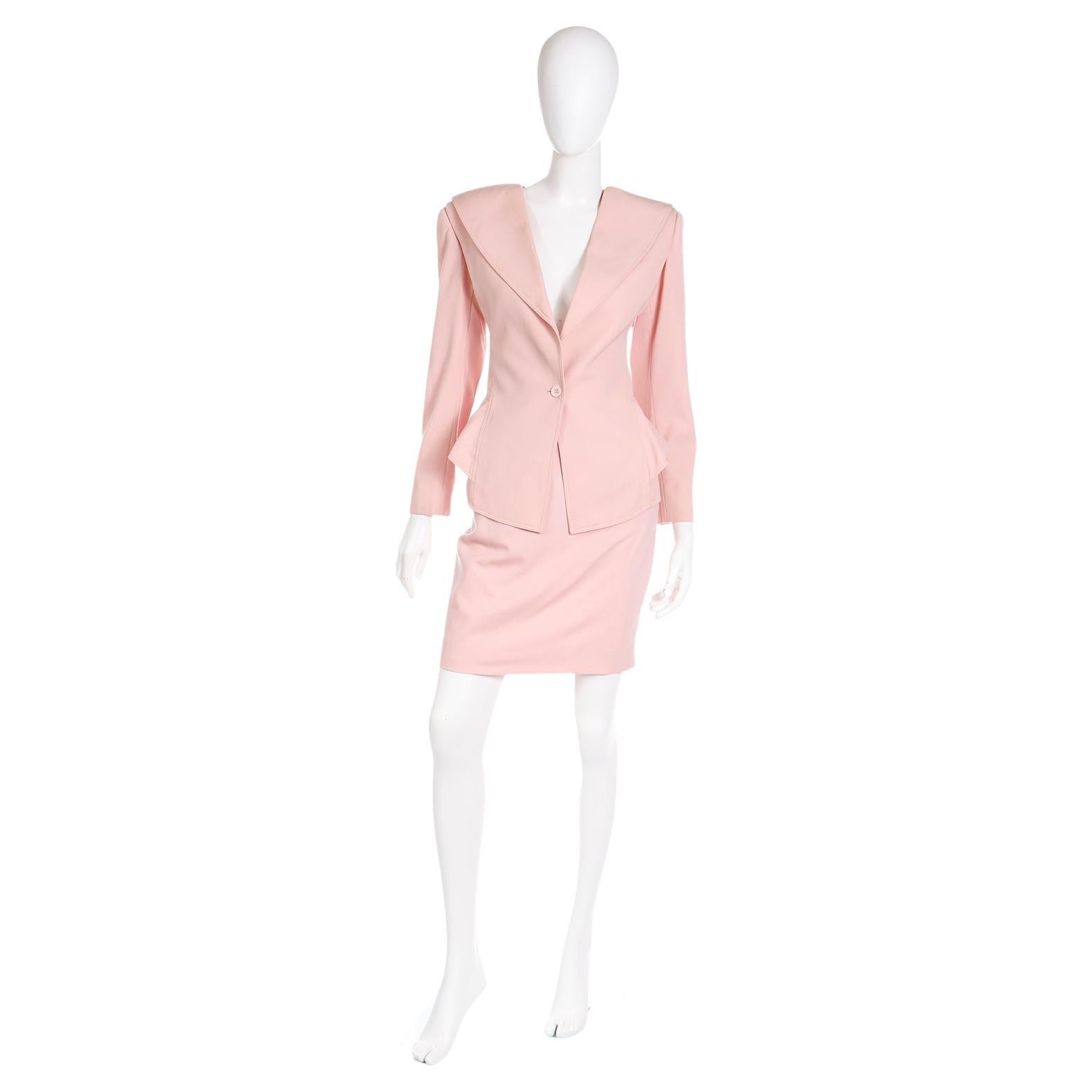 This vintage Ungaro Parallele pretty pink 2pc suit includes a low V cut peplum blazer and a slim pencil skirt.  Suits are such a great investment because they can be worn as a set or as separates. The pink blazer has a wide lapels and a single pink