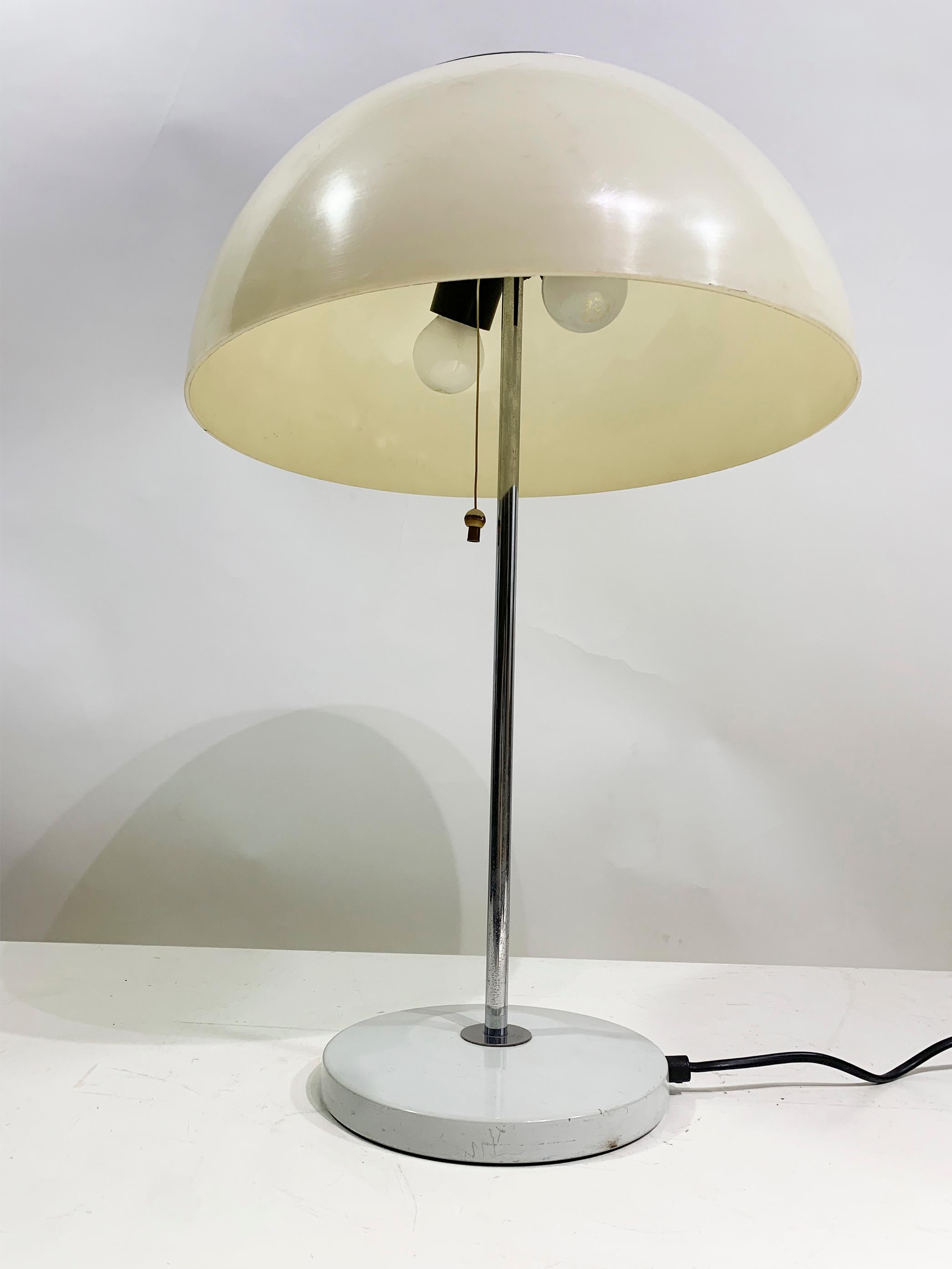 This exquisite antique mushroom lamp from the 1970s, crafted by Unilux.
With a lampshade made from a rich, cream-colored polypropylene. The base is constructed from a lustrous chromed metal, adding a touch of sophistication.
The lamp operates via a