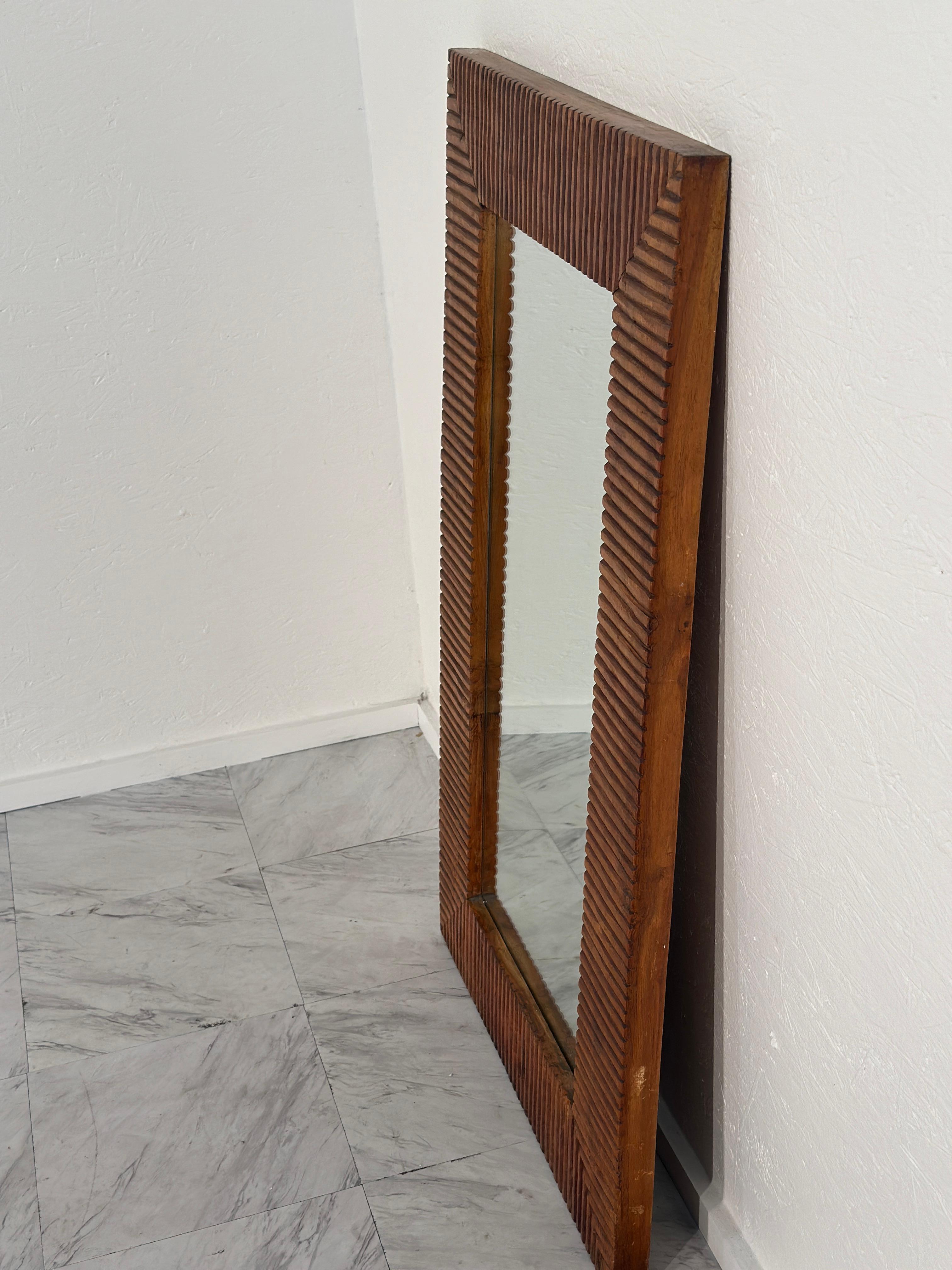 A distinctive 1980s Vintage Rectangular Wood Wall Mirror, boasting a unique design that combines vintage charm with modern flair, perfect for adding character to any space.

