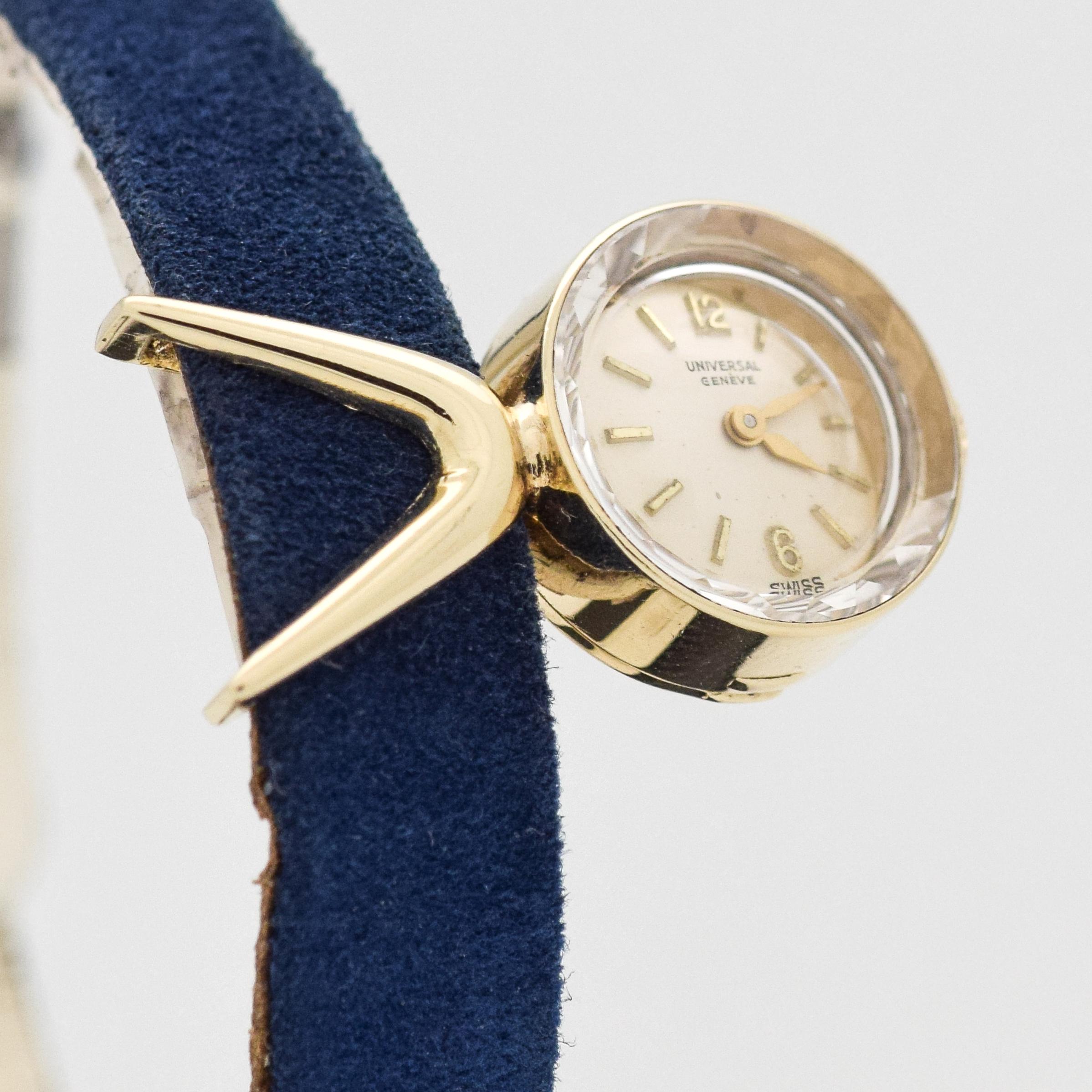 1960's Vintage Universal Geneve Ladies Unique Chameleon 14k Yellow Gold watch with Original Silver Dial with Applied Gold Arabic 6 and 12 with Stick/Bar/Baton Markers. 24mm x 15mm lug to lug (0.94 in. x 0.59 in.) - 17 jewel, manual caliber movement. 